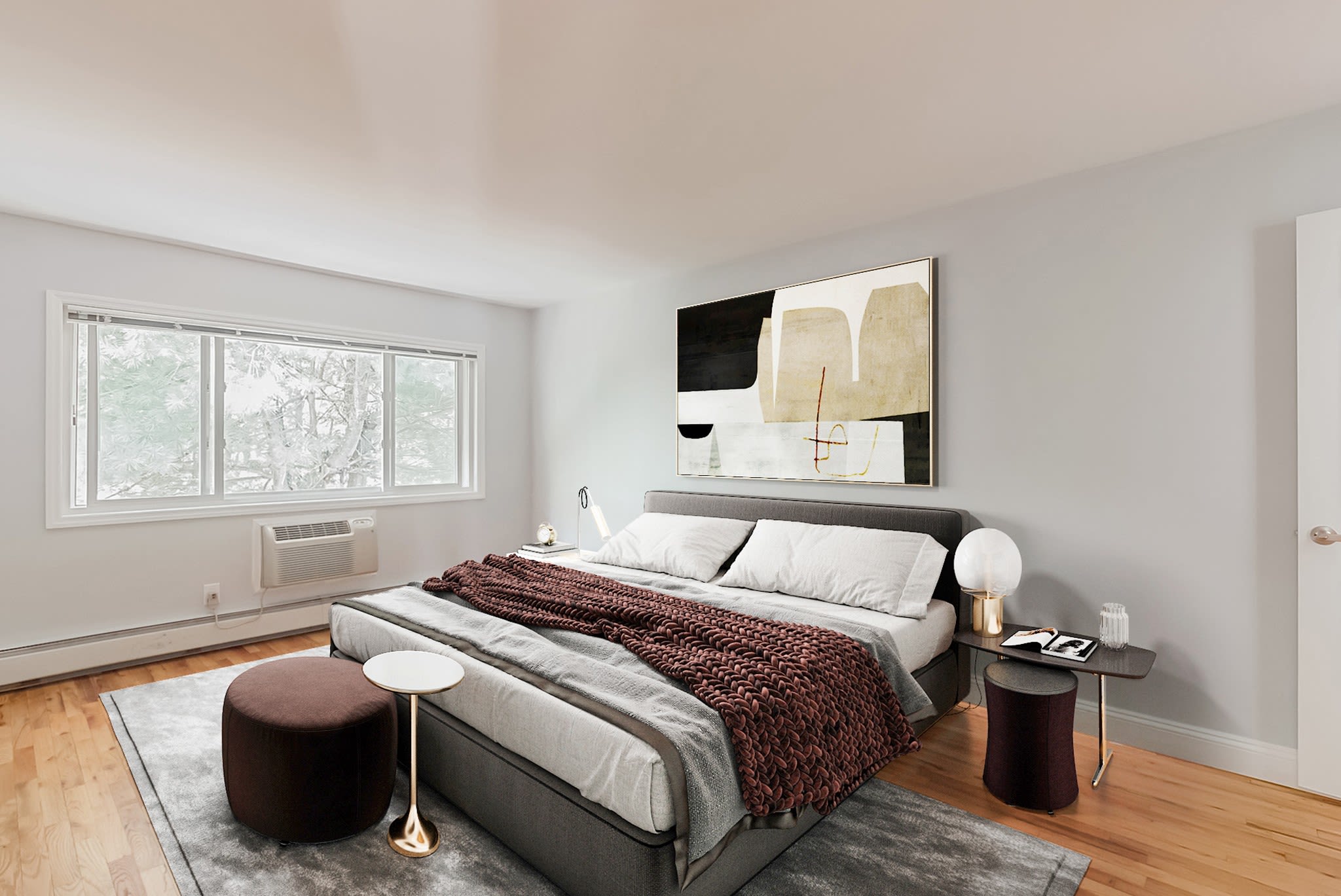 Master bedroom with window at Eagle Rock Apartments at Nesconset in Nesconset, New York