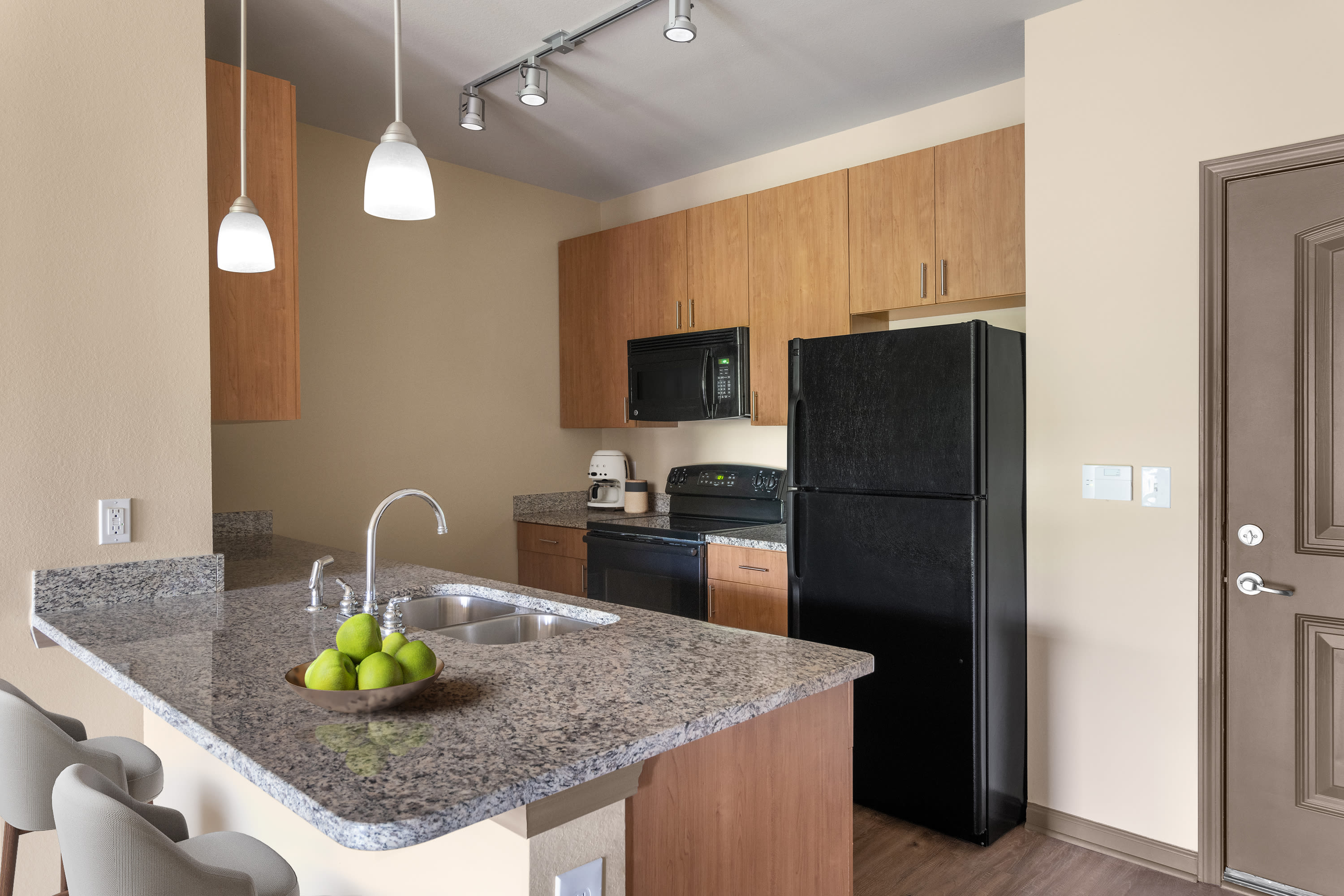 Kitchen with a double sink at The Addison at South Tryon | Apartments & Townhomes in Charlotte, North Carolina