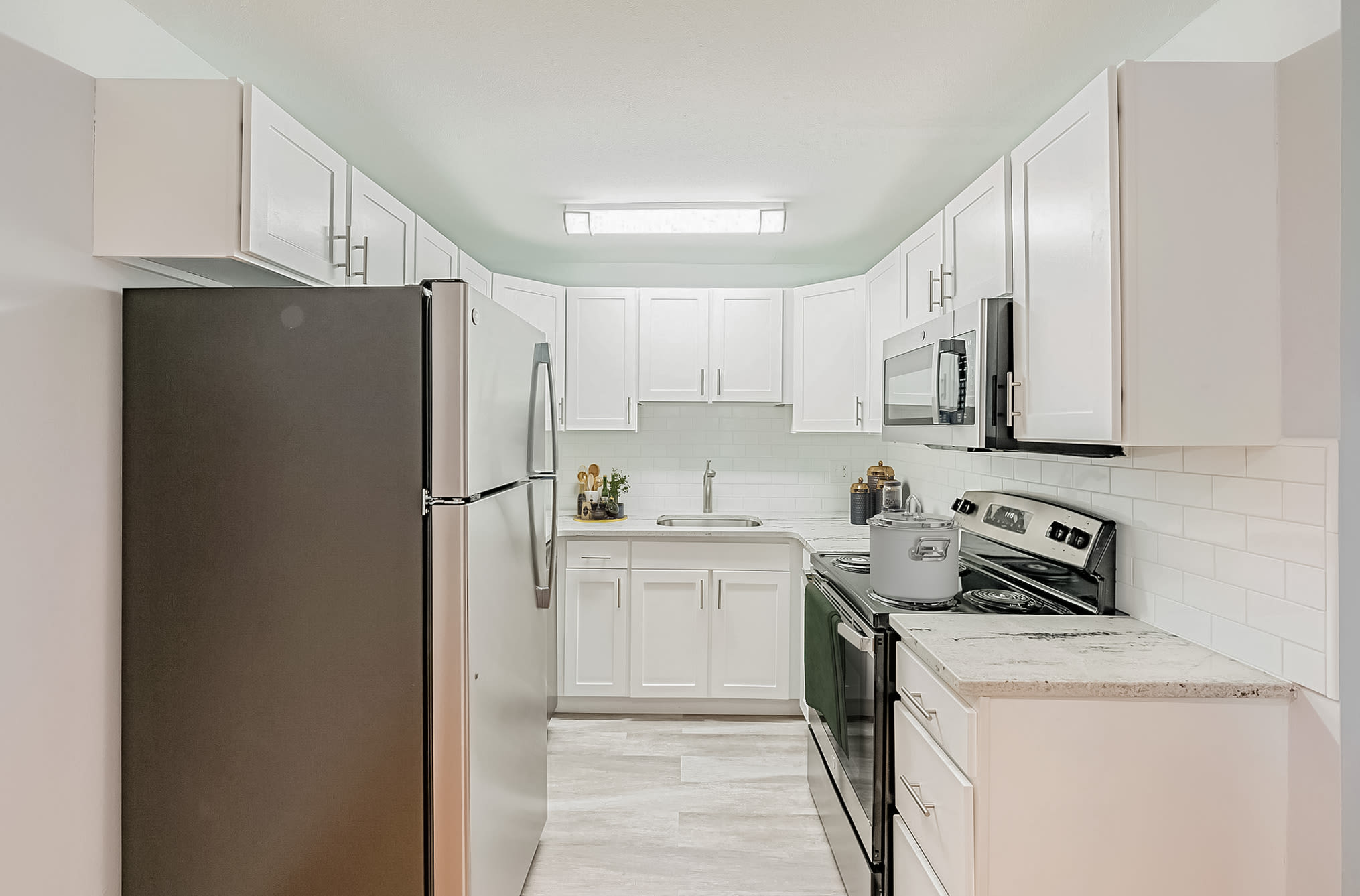 Kitchen with freshly painted cabinetry at Eagle Rock Apartments at West Hartford in West Hartford, Connecticut