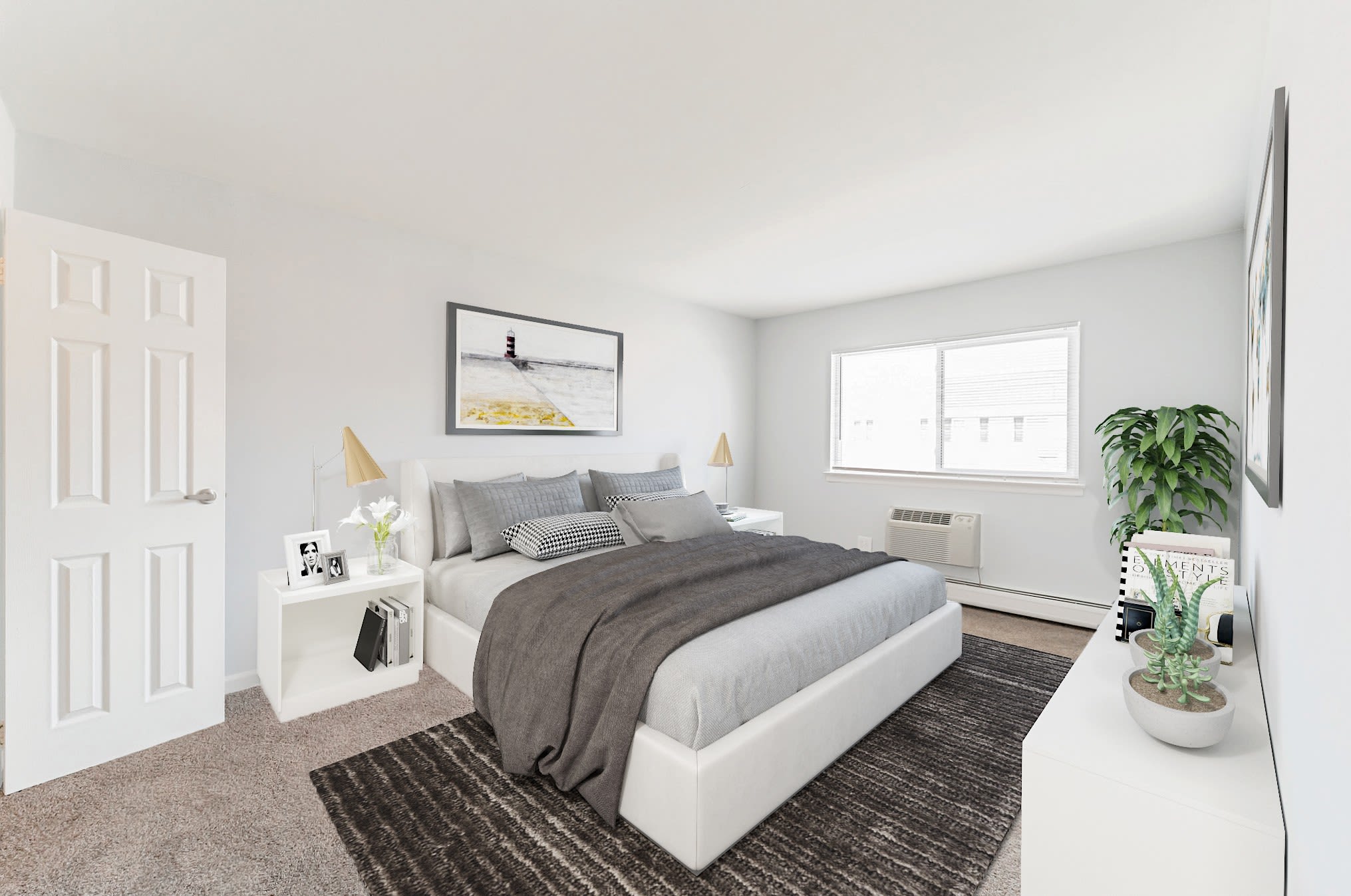 Master bedroom with large window at Mid Island Apartments Bay Shore, New York