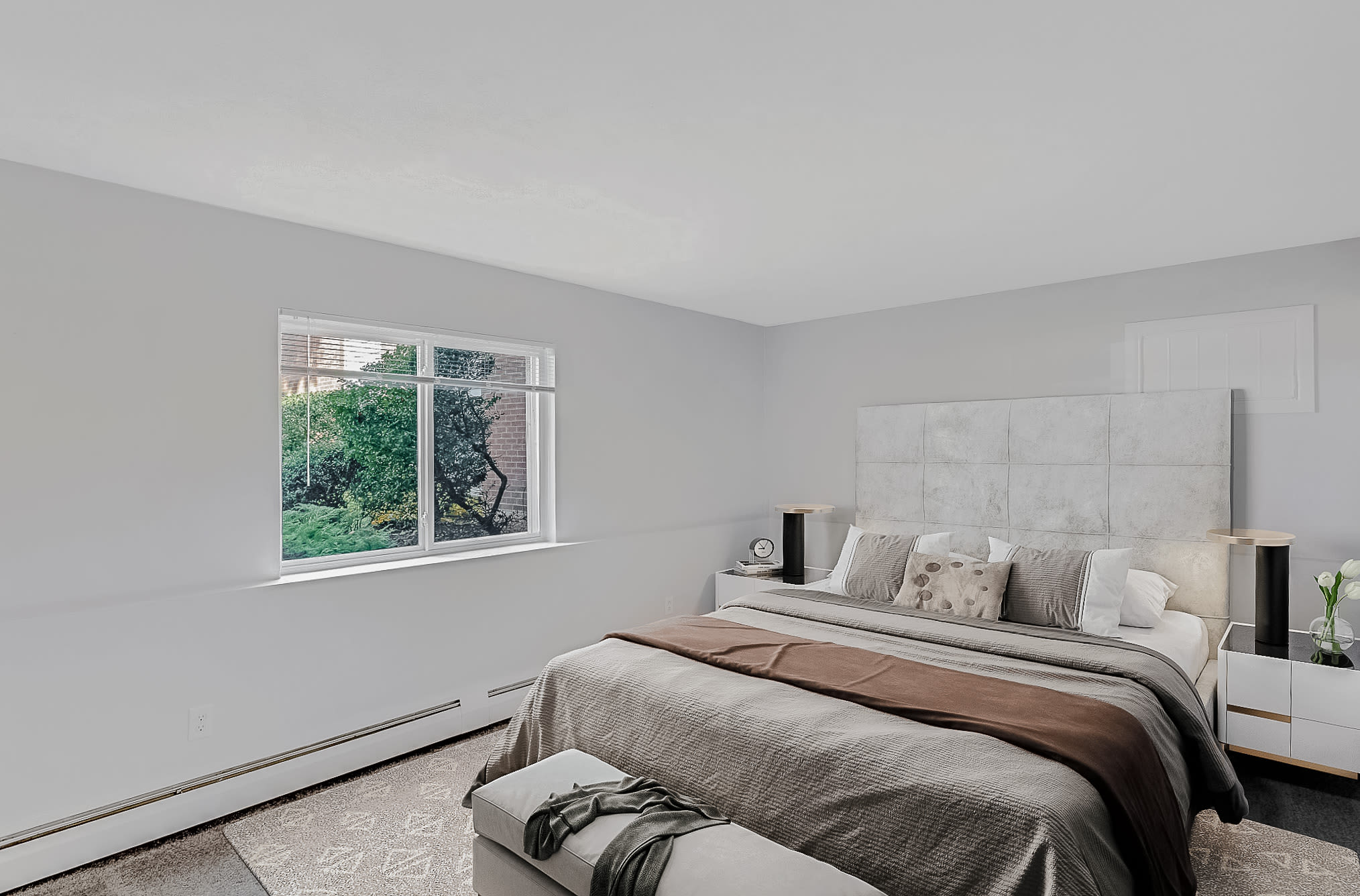 Master bedroom with window at Park Village West in Westborough, Massachusetts
