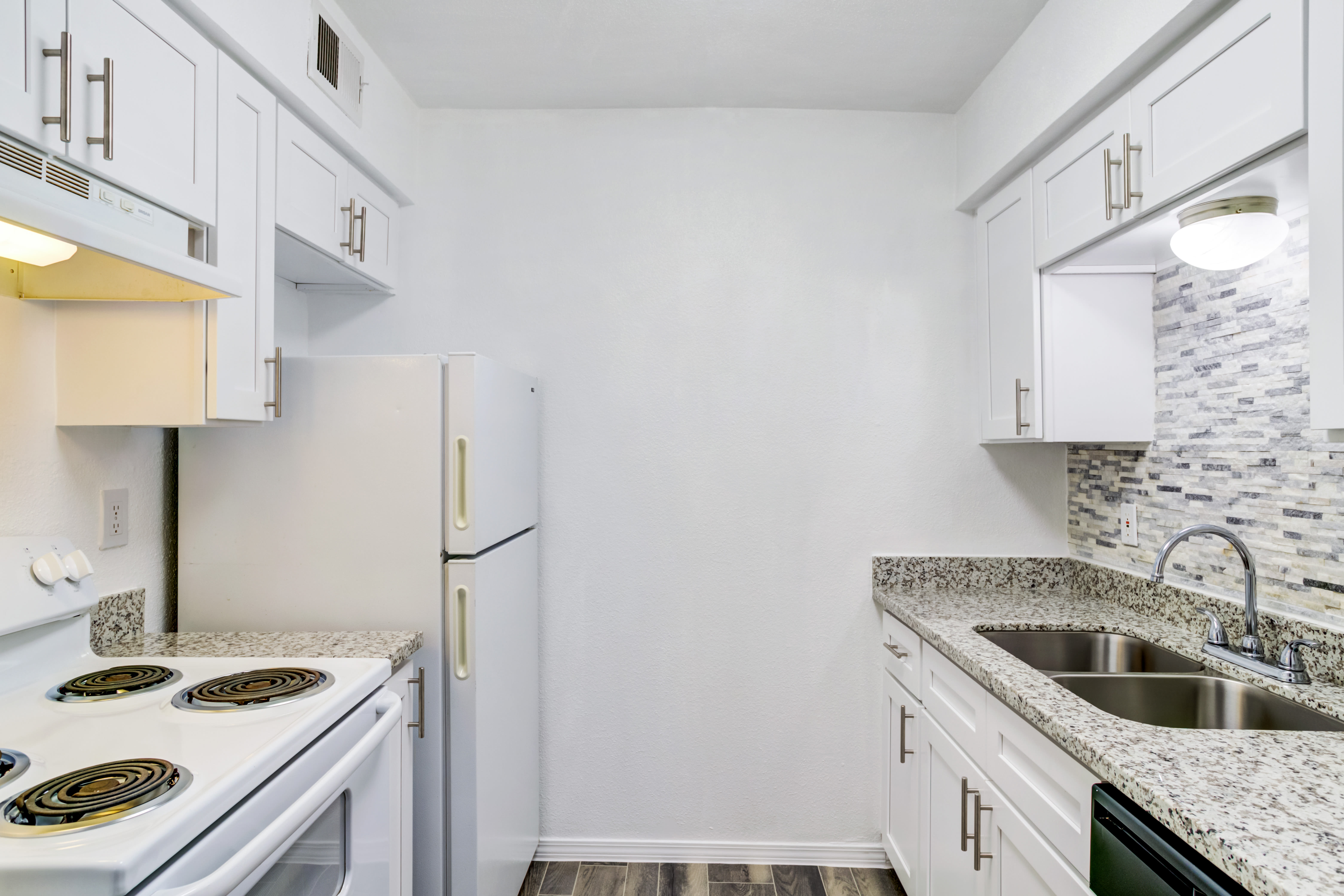 White appliance kitchen at Brighton Oaks in Houston, Texas