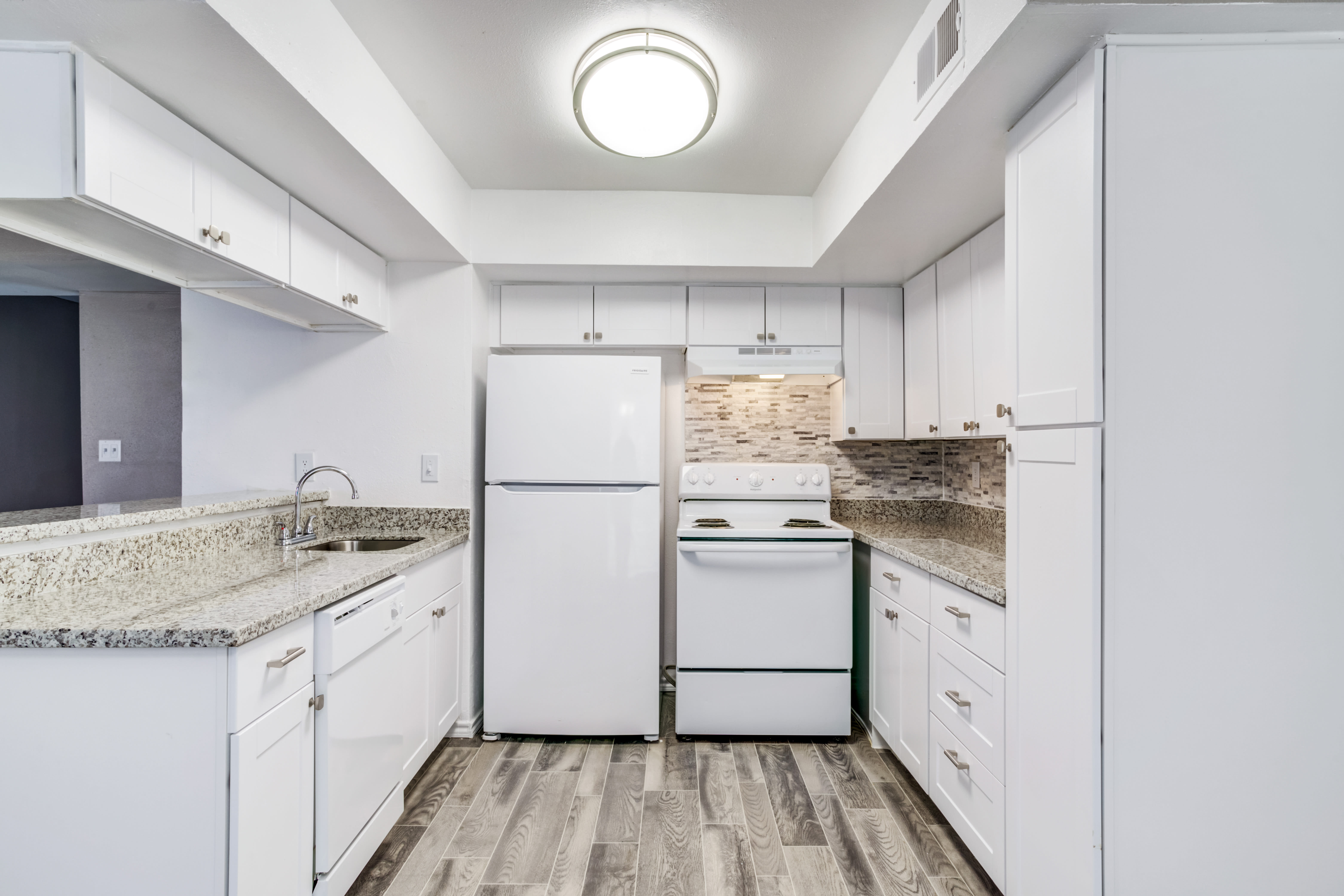 Kitchen with subway tiles at Country Woods in Houston, Texas