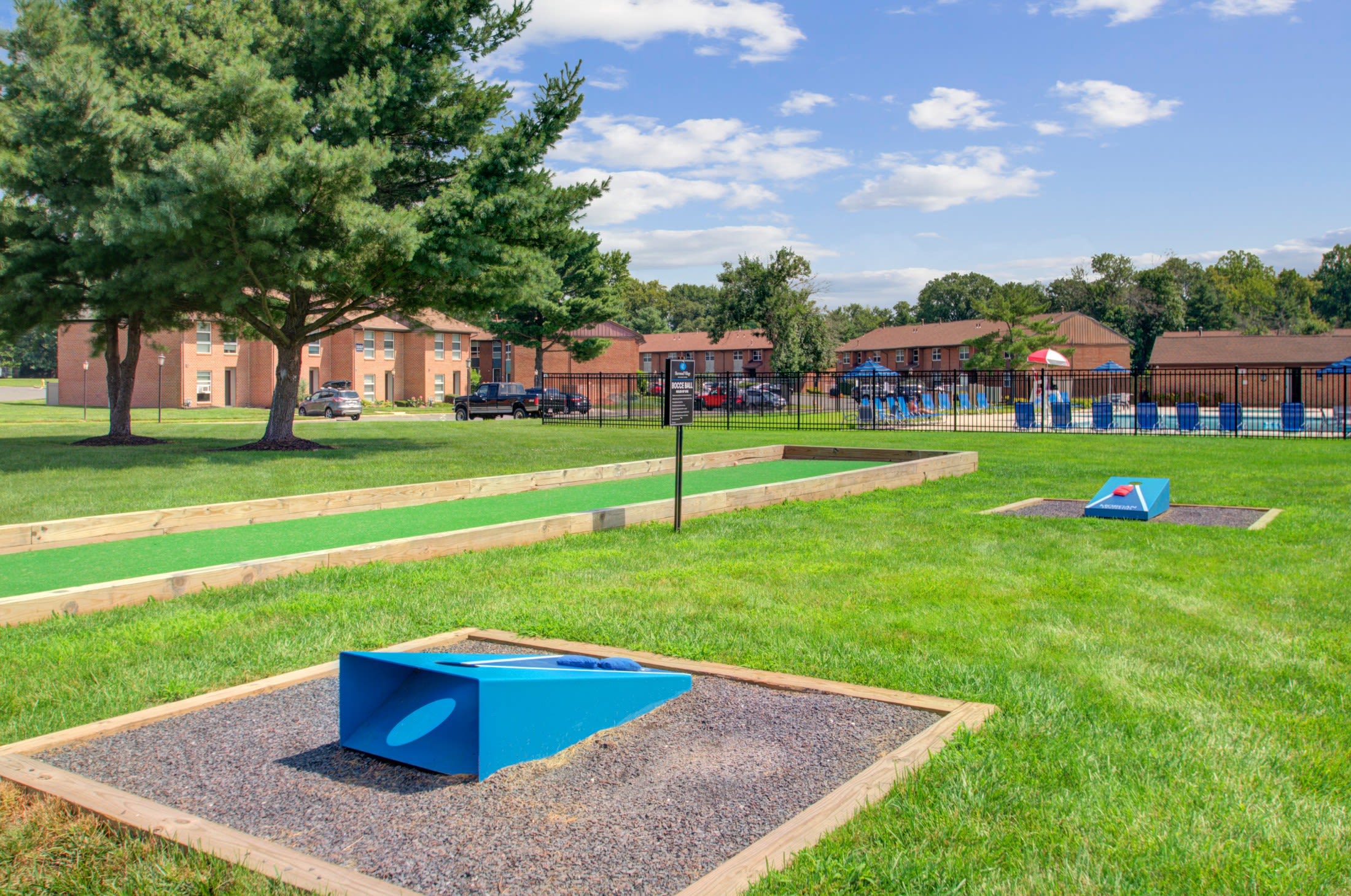 Corn hole and bocce ball on the lawn at Sherwood Village Apartment & Townhomes in Eastampton, New Jersey