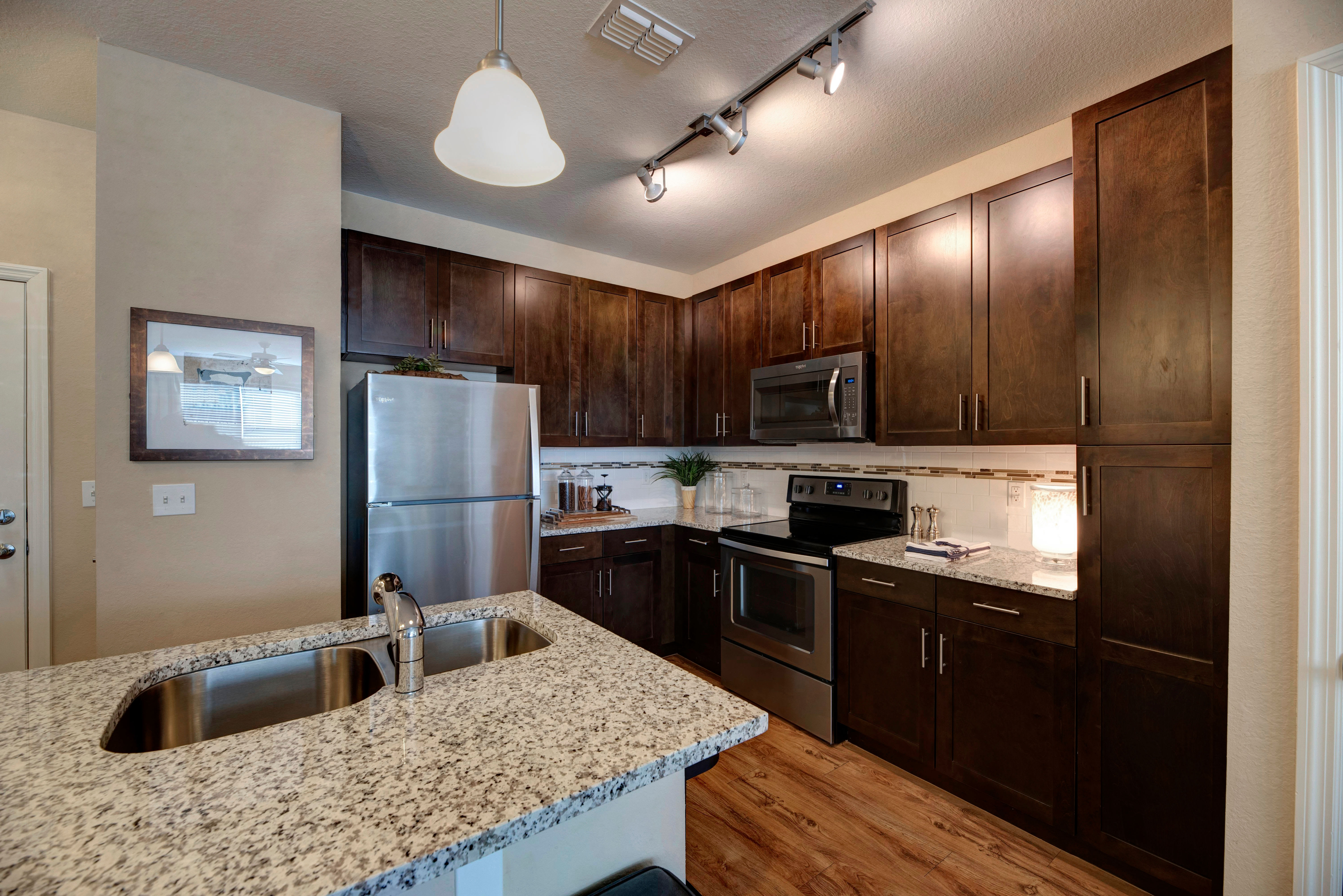 Kitchen with dark cabinets at Integra Lakes in Casselberry, Florida