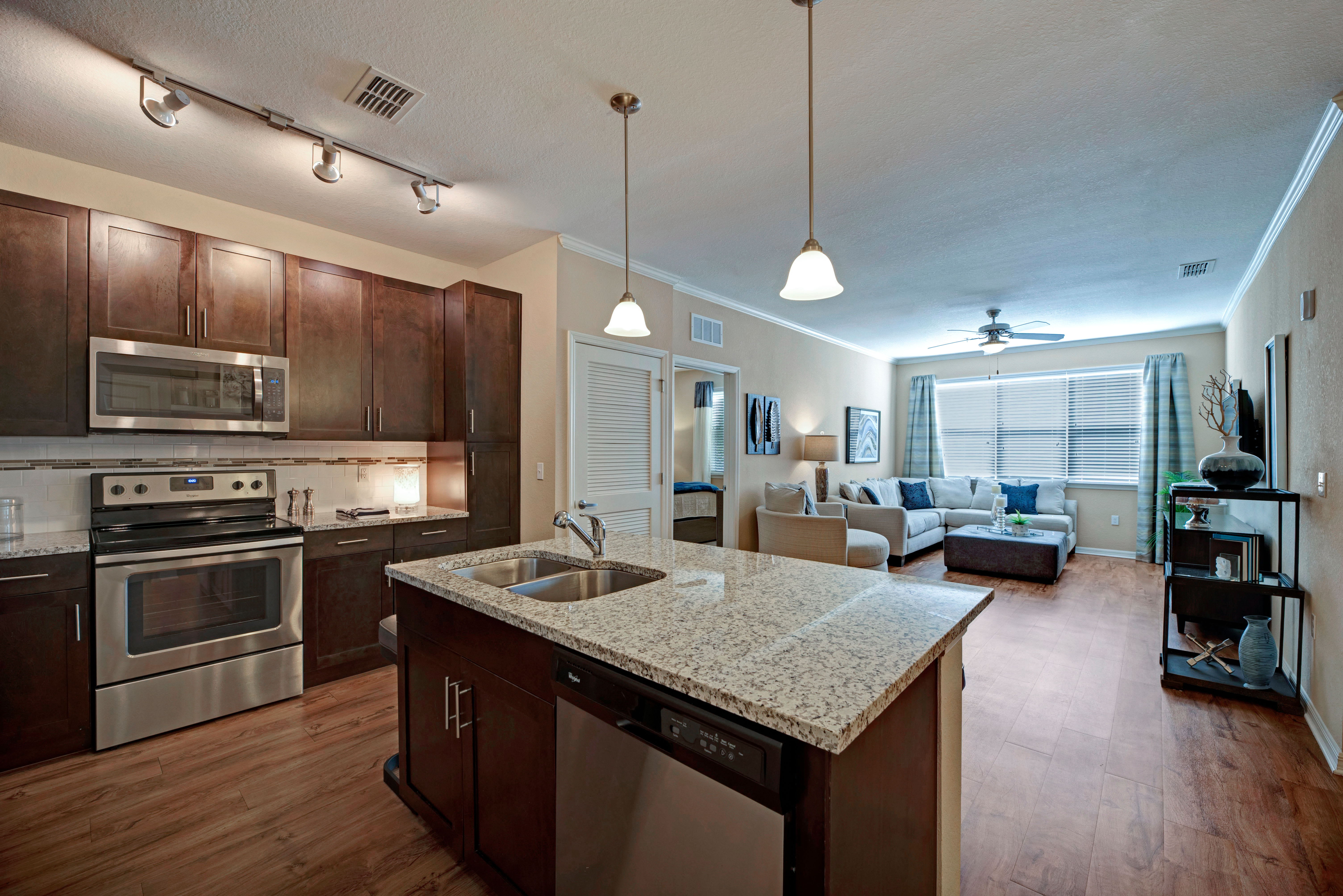 View of large kitchen and living room at Integra Lakes in Casselberry, Florida