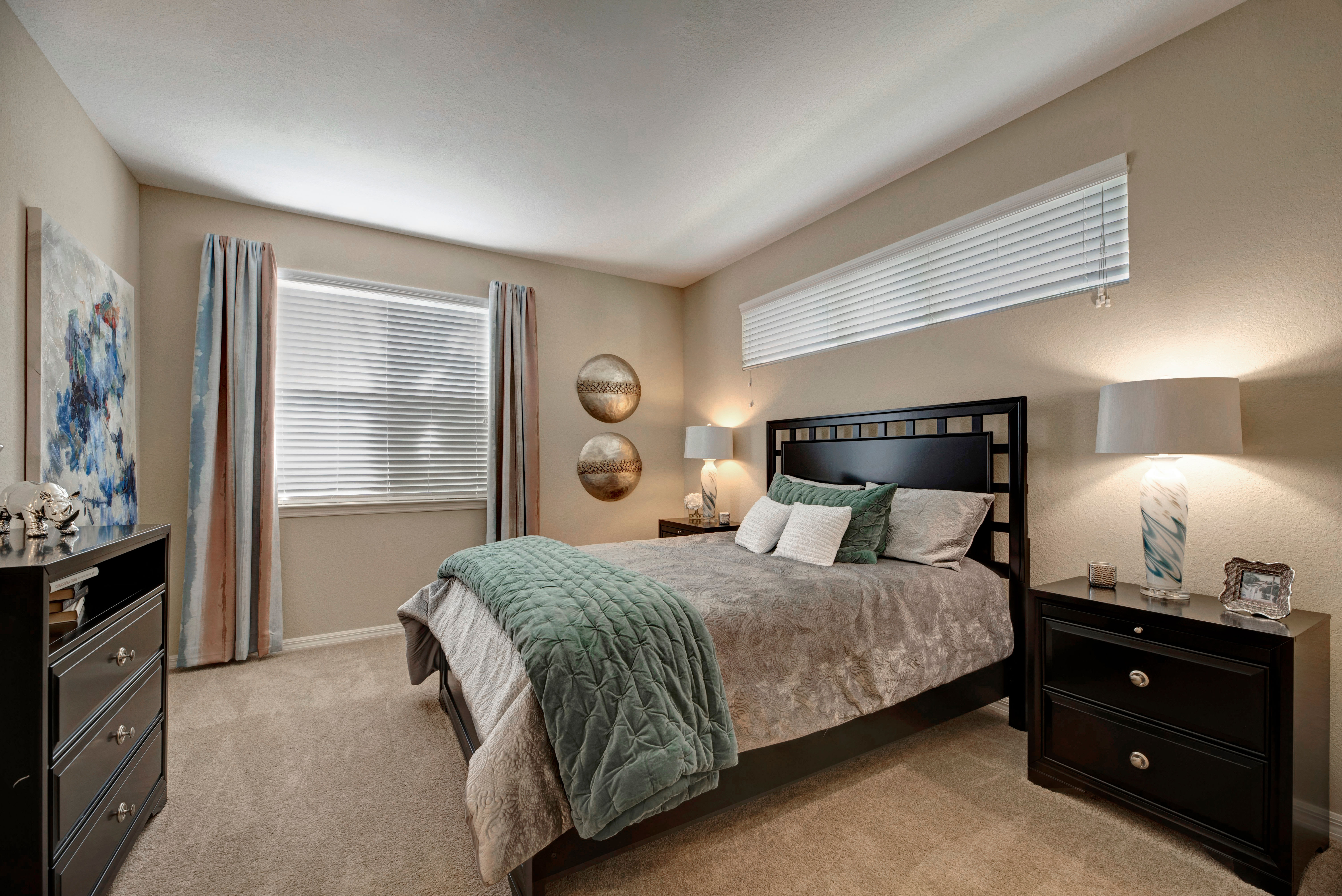 Bedroom with lots of windows at Integra Lakes in Casselberry, Florida