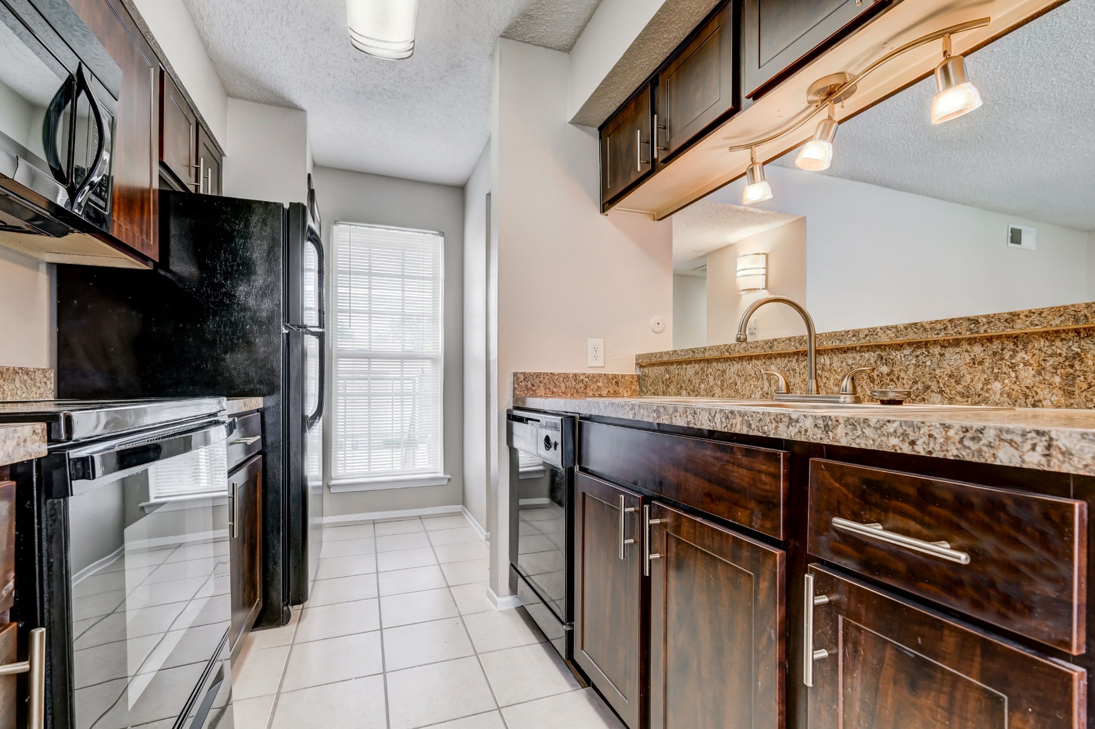 Fully equipped modern kitchen at Grand Seasons Apartment Homes in Dallas, Texas