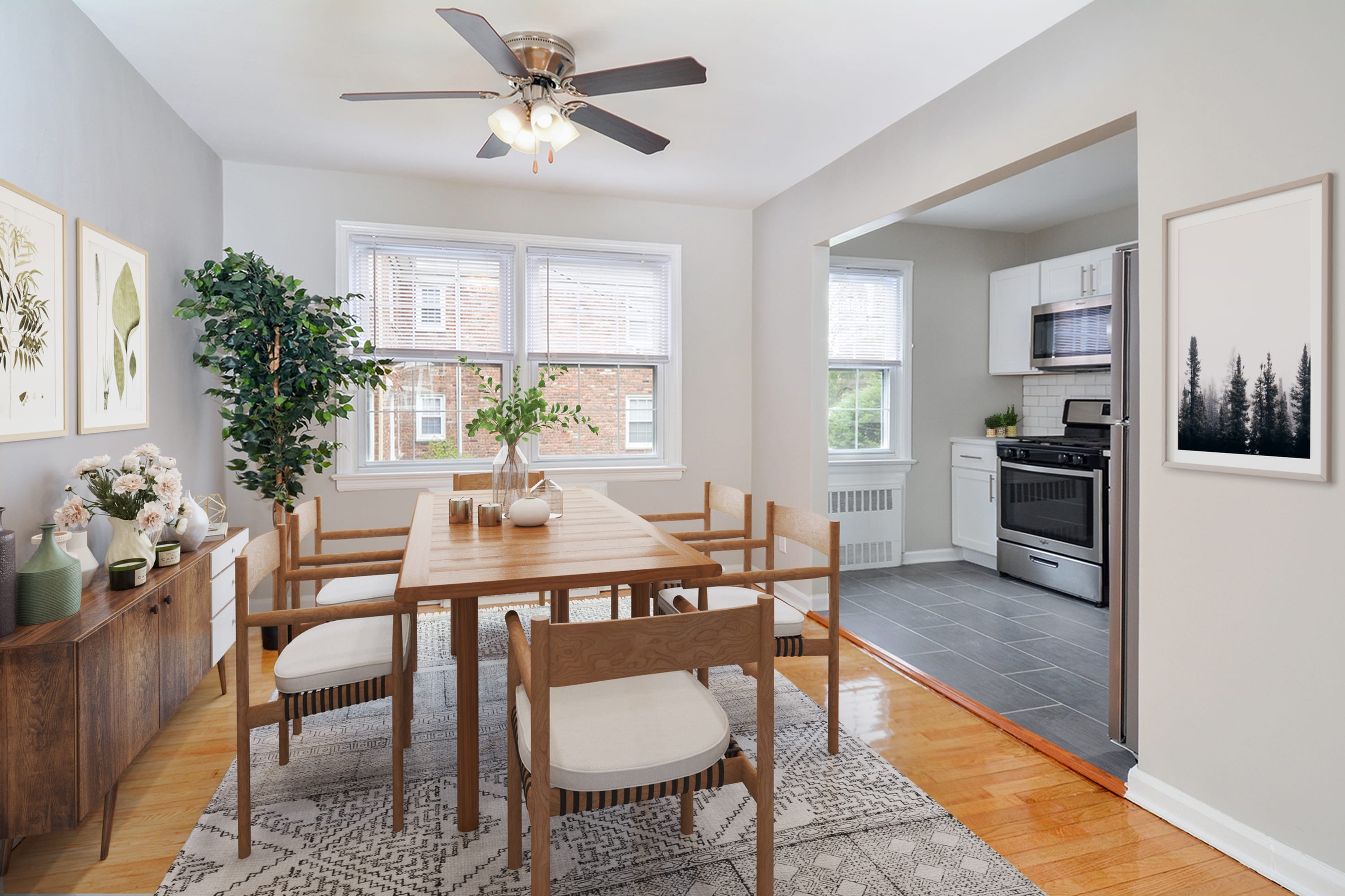 Model dining room with access to kitchen at Parc at Summit in Summit, New Jersey