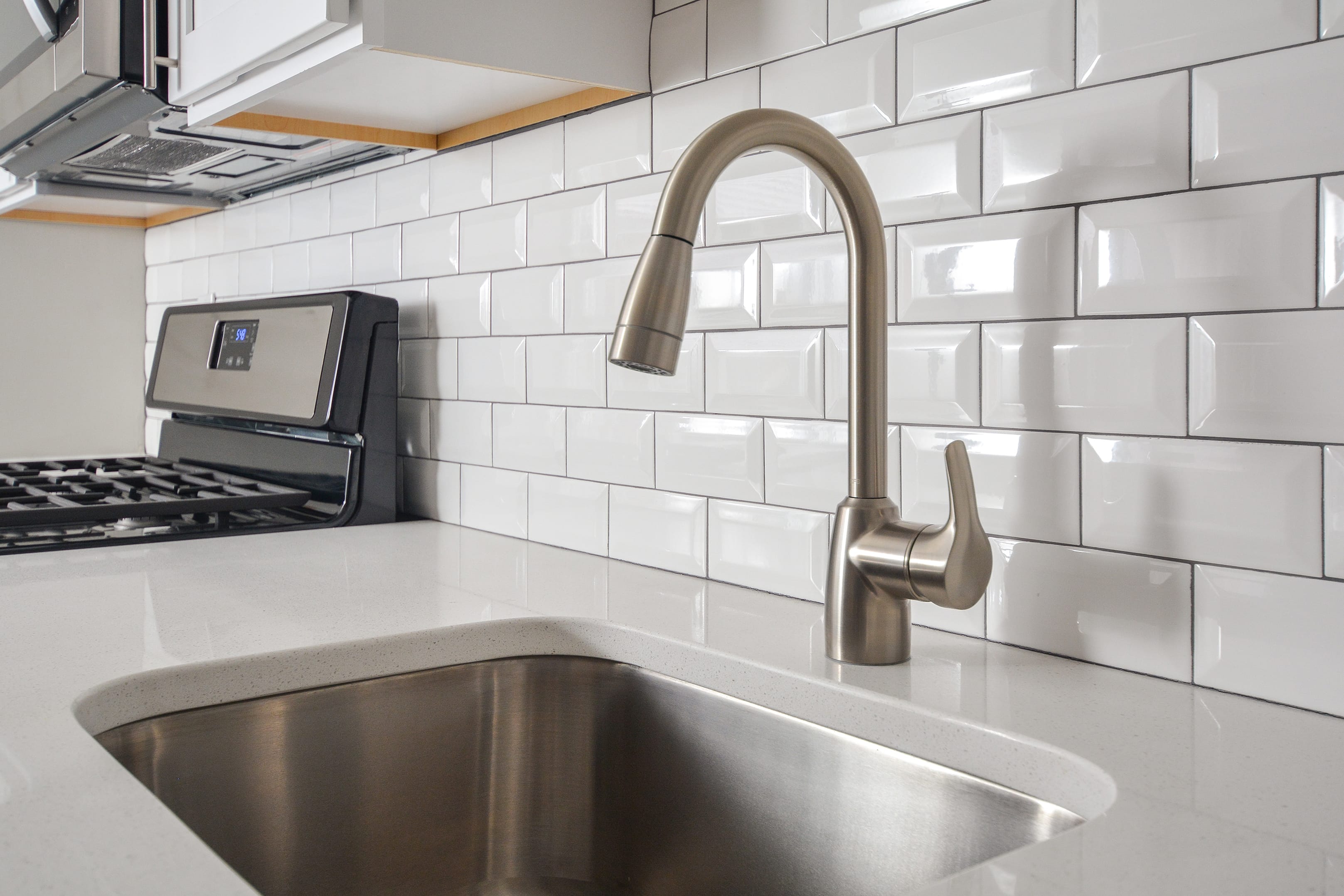Tile backsplash and stainless-steel appliances at Parc at Summit in Summit, New Jersey