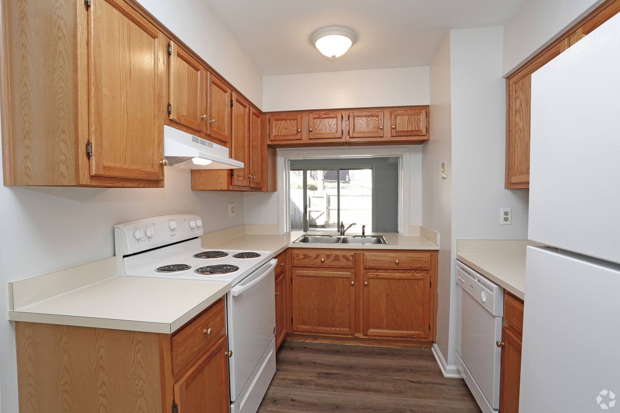 Model kitchen with wood cabinets at River Oaks, Pittsburgh, Pennsylvania