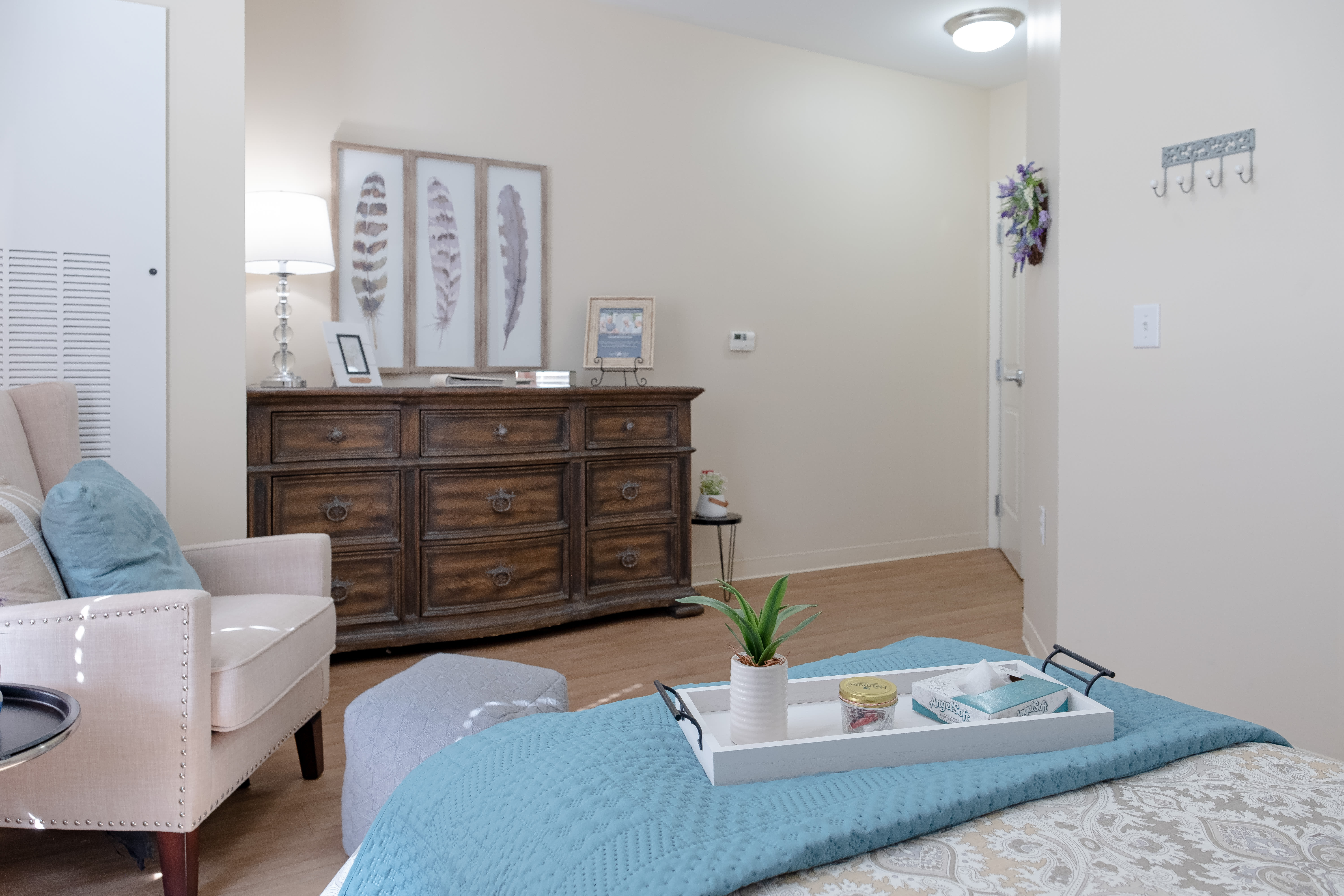 Bedroom with dressing table with drawers at The Harmony Collection at Roanoke - Assisted Living in Roanoke, Virginia