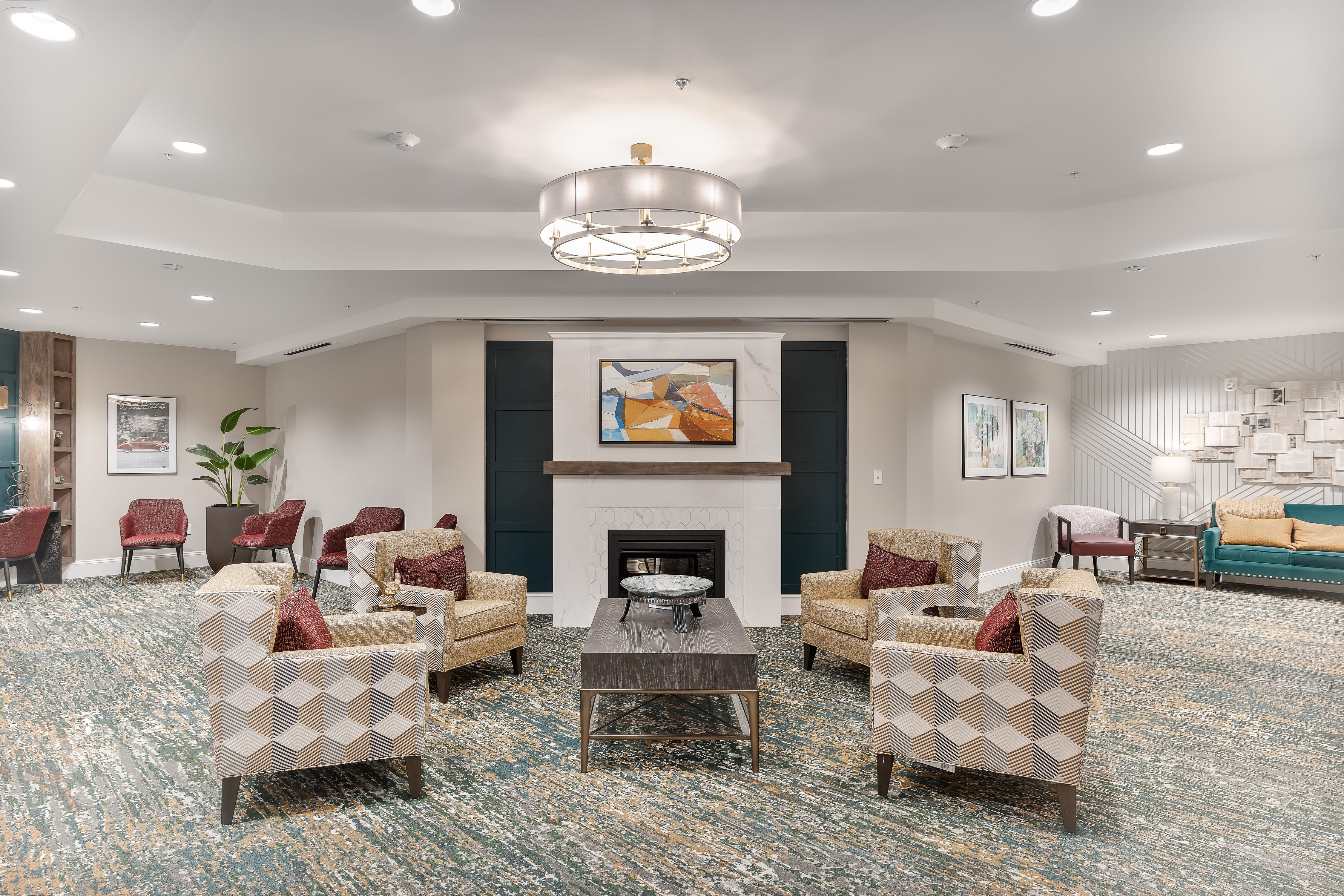 Lounge area with a fireplace at Anthology of Farmington Hills in Farmington Hills, Michigan