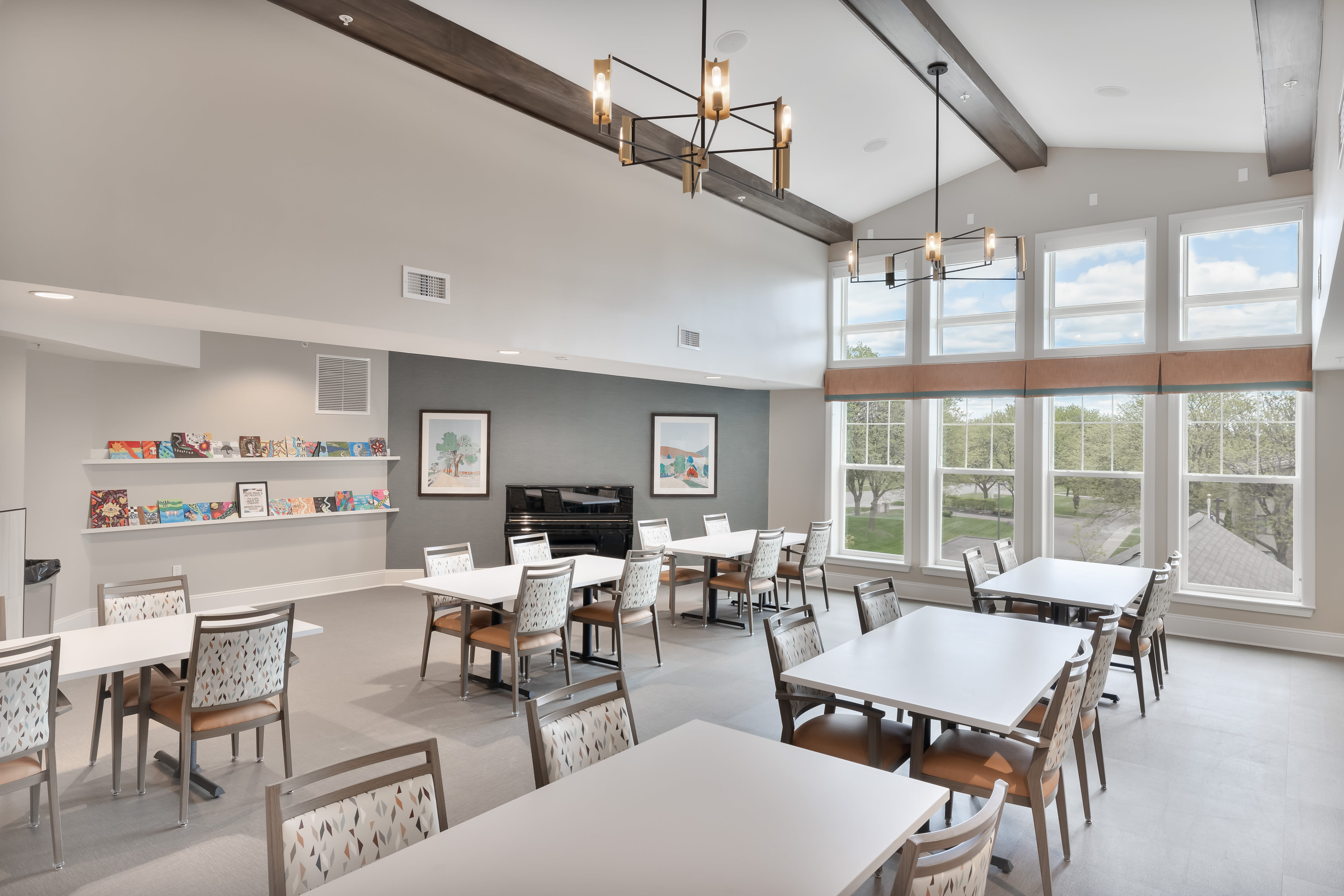 Dining room with big windows at Anthology of Farmington Hills in Farmington Hills, Michigan