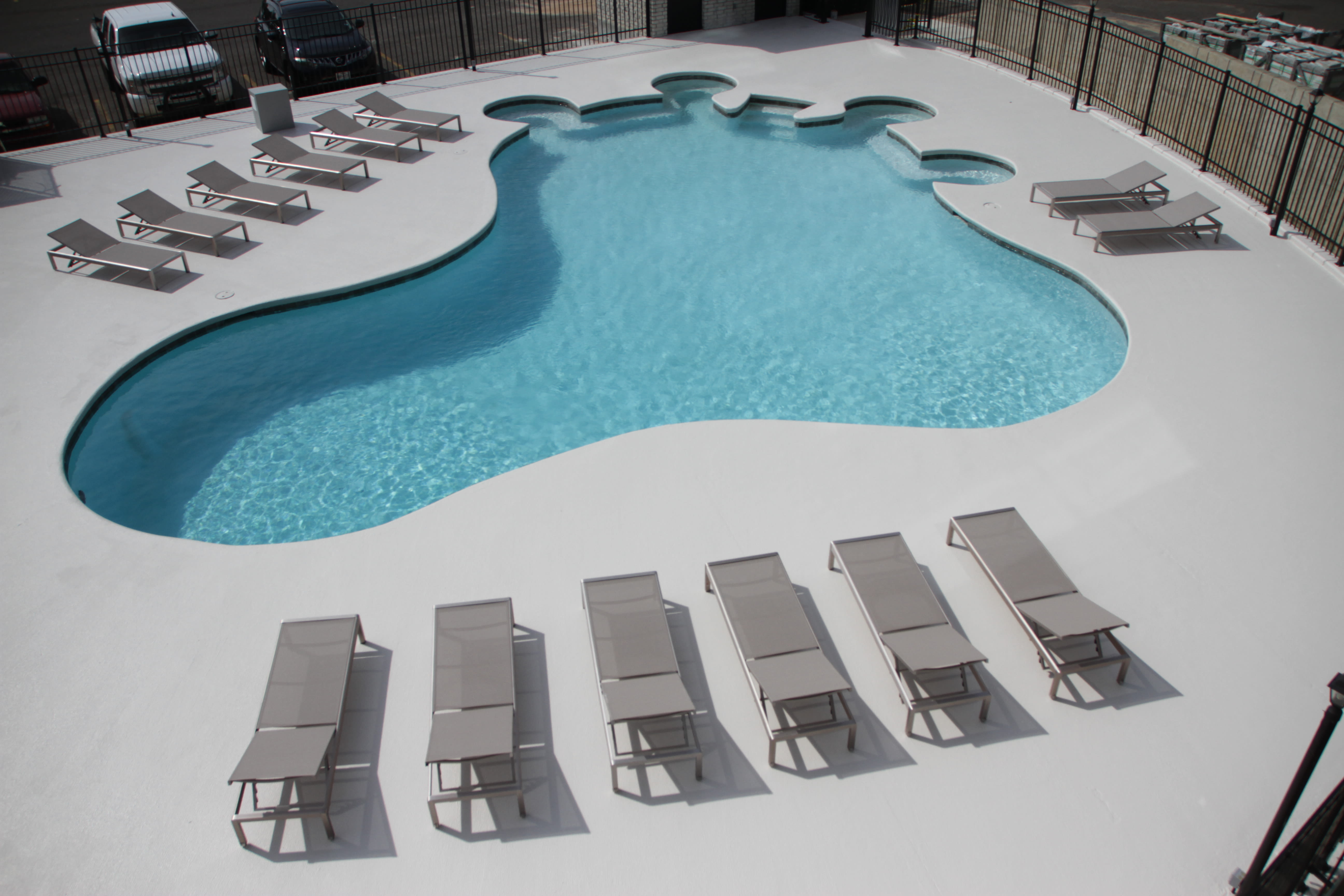 Poolside patio with chairs at The View Tower Apartments in Shreveport, Louisiana