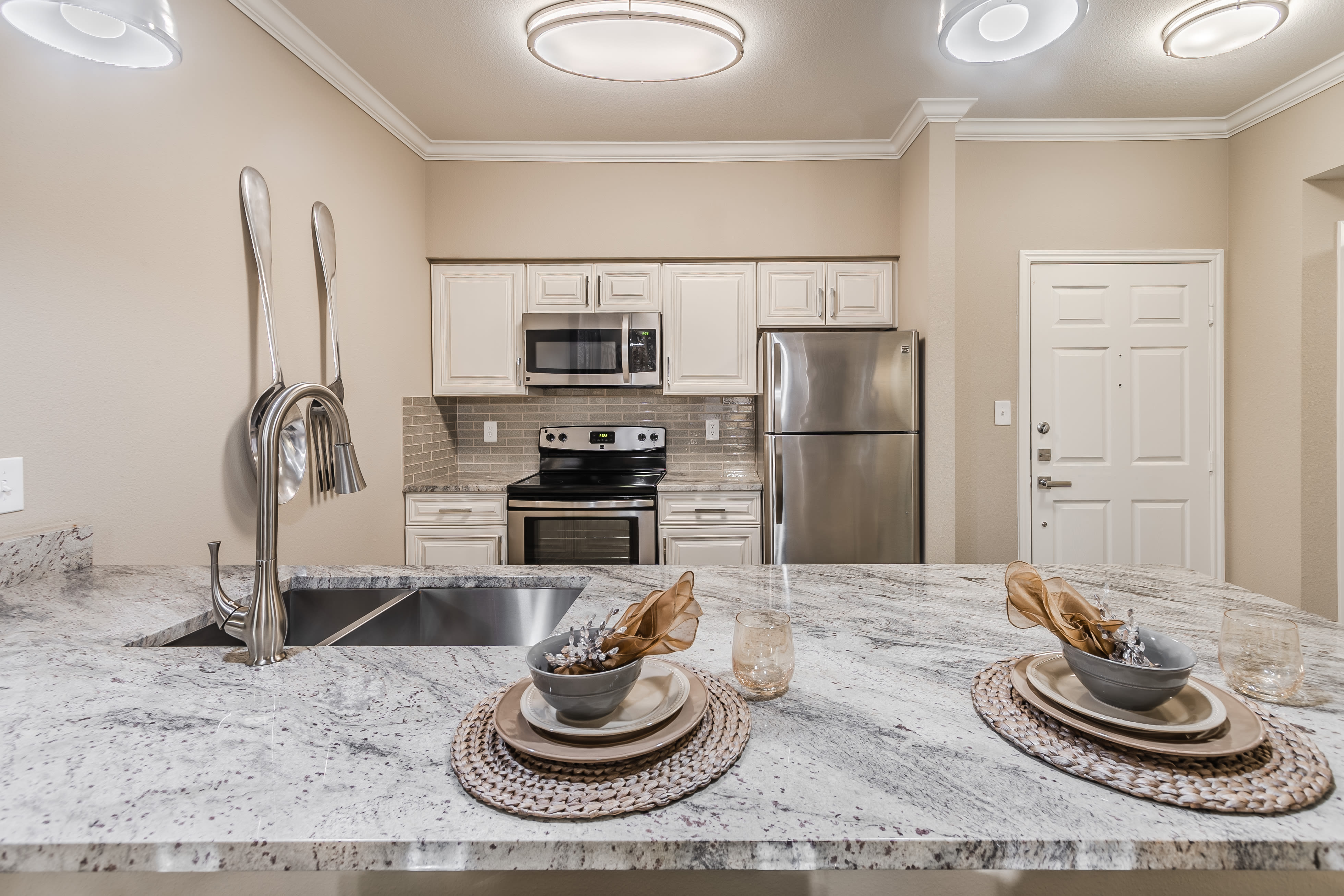 Modern kitchen of senior apartment at The Spring at Silverton in Fort Worth, Texas.