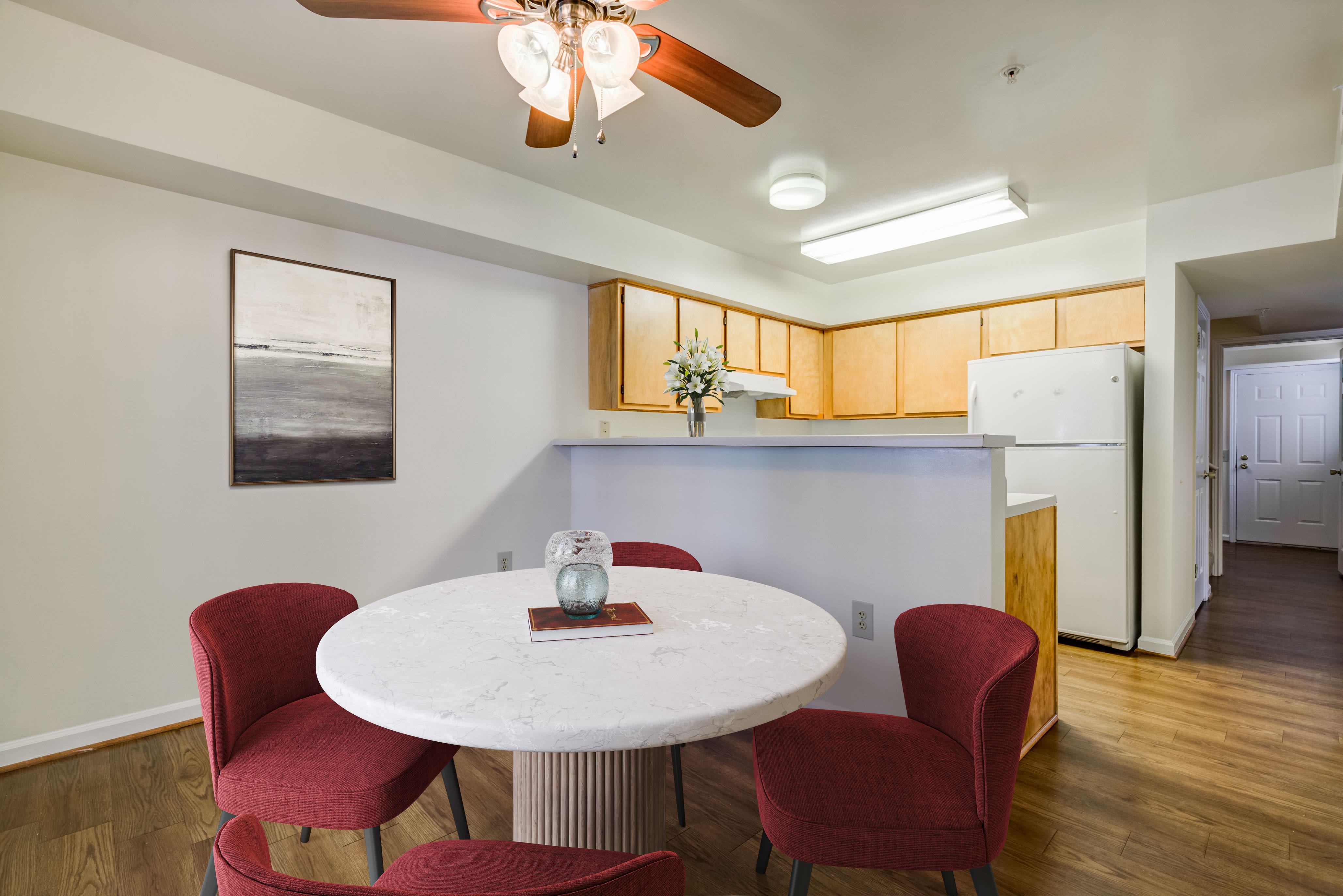 Table with 2 chairs near the kitchen at Dahlgren Townhomes in Dahlgren, Virginia