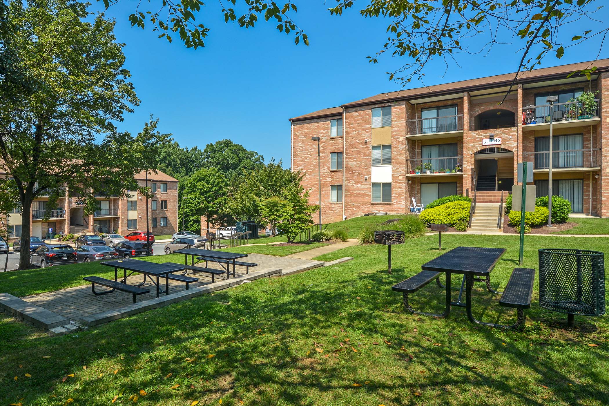 Picnic tables on the grounds at The Flats at Columbia Pike, Silver Spring, Maryland
