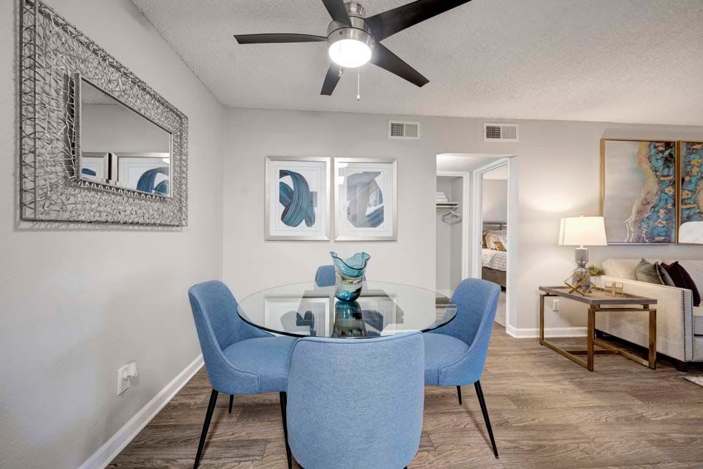 Dining space table at Hampden Heights Apartments in Denver, Colorado features hardwood floors