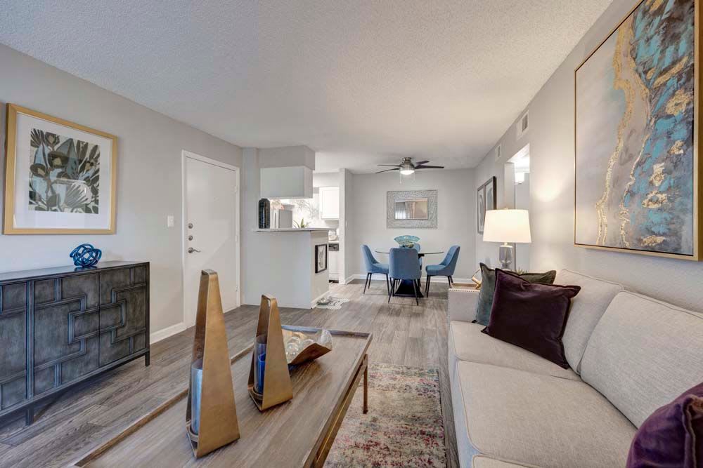 Living room and dining room space at Hampden Heights Apartments in Denver, Colorado