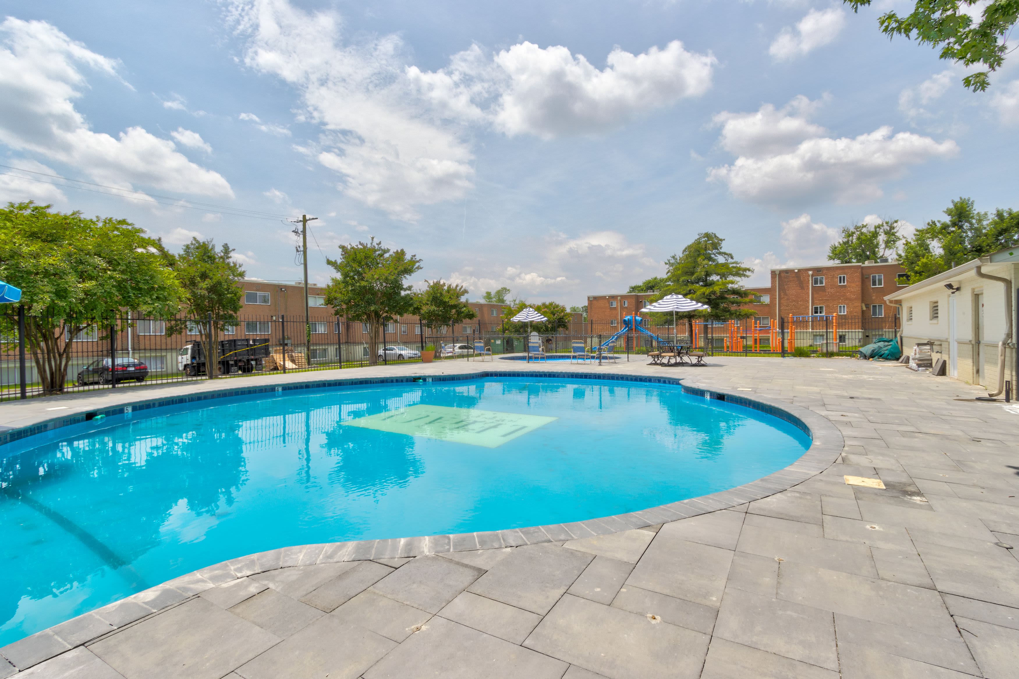 Pool side view at Flats of Forestville Apartment Homes in Forestville, Maryland