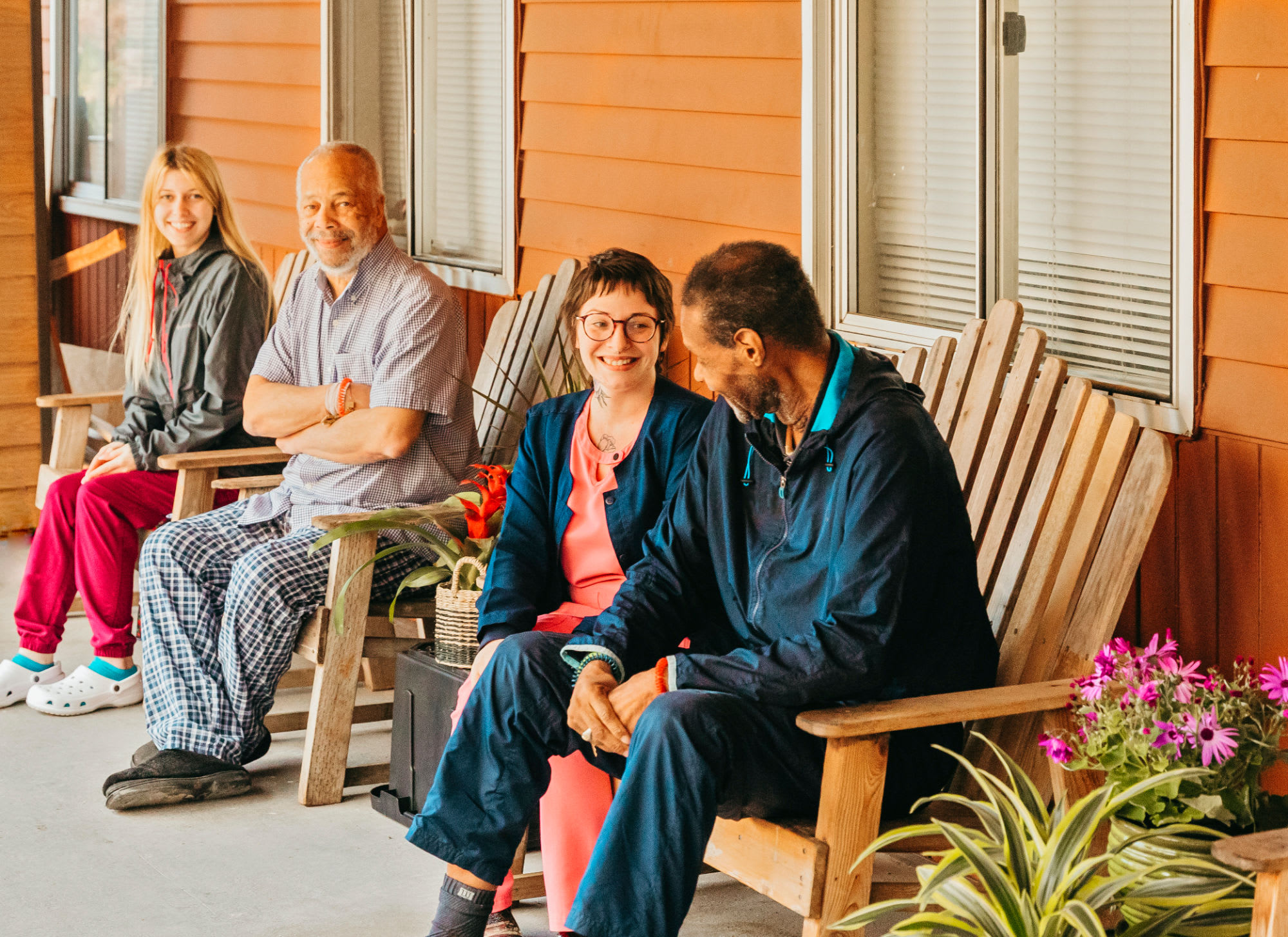 Residents socializing on the porch at 6th Ave Senior Living in Tacoma, Washington