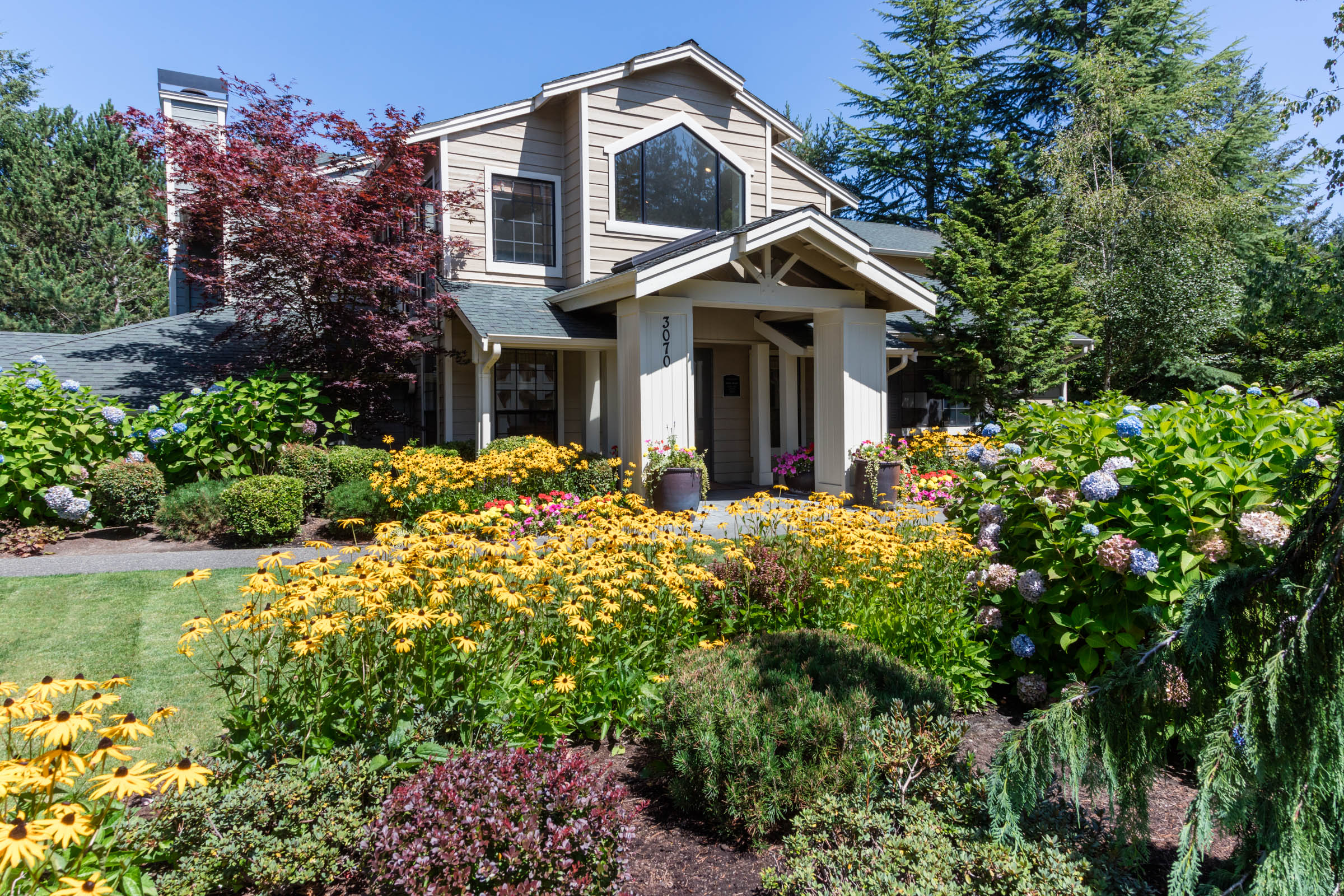 Our community's sign at the entrance to Madison Sammamish Apartments in Sammamish, Washington