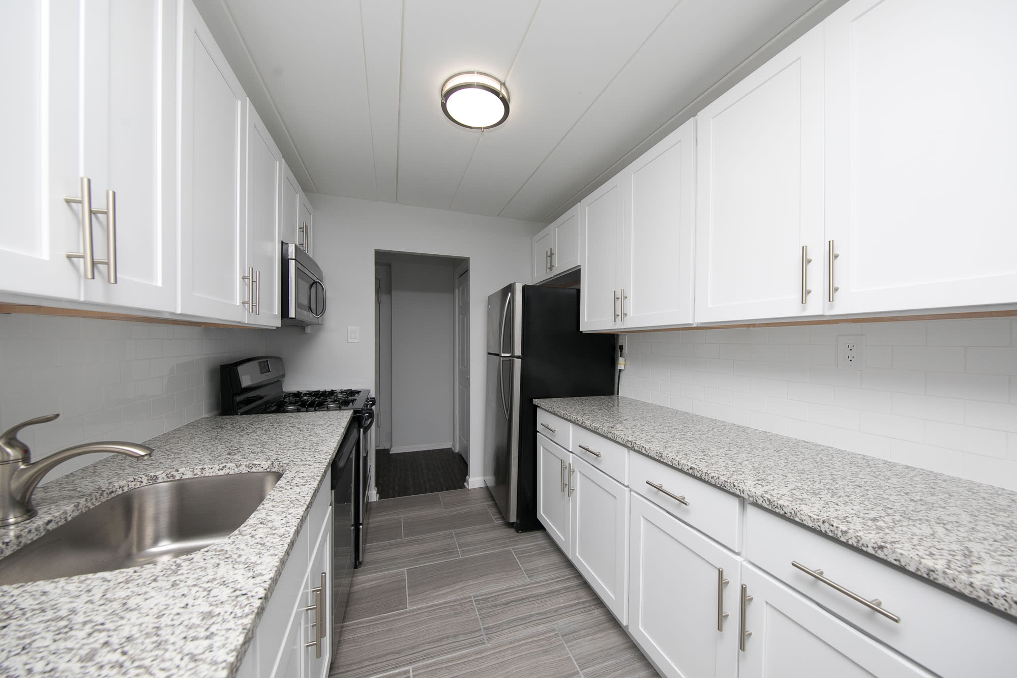 Model kitchen with white cabinets at Parc at Cherry Hill, Cherry Hill, New Jersey