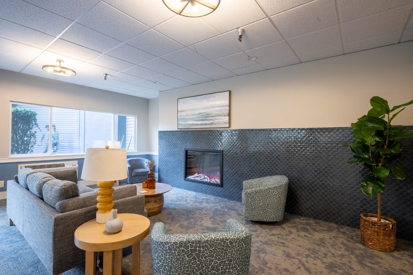 Relax by the fire at The Village Senior Living in Tacoma, Washington