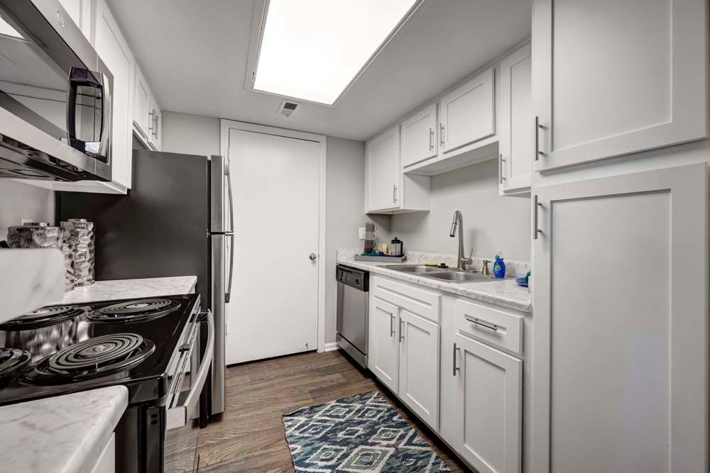 Well lit kitchen at Waterfield Court Apartment Homes in Aurora, Colorado