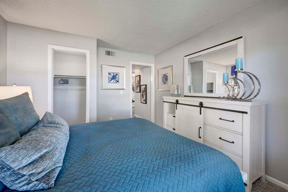 Cozy apartments with a bedroom at Waterfield Court Apartment Homes in Aurora, Colorado