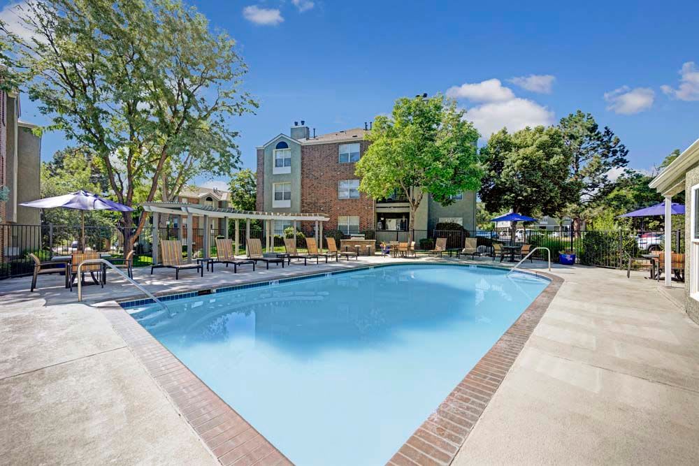 Luxury apartments with a swimming pool at Waterfield Court Apartment Homes Aurora, CO