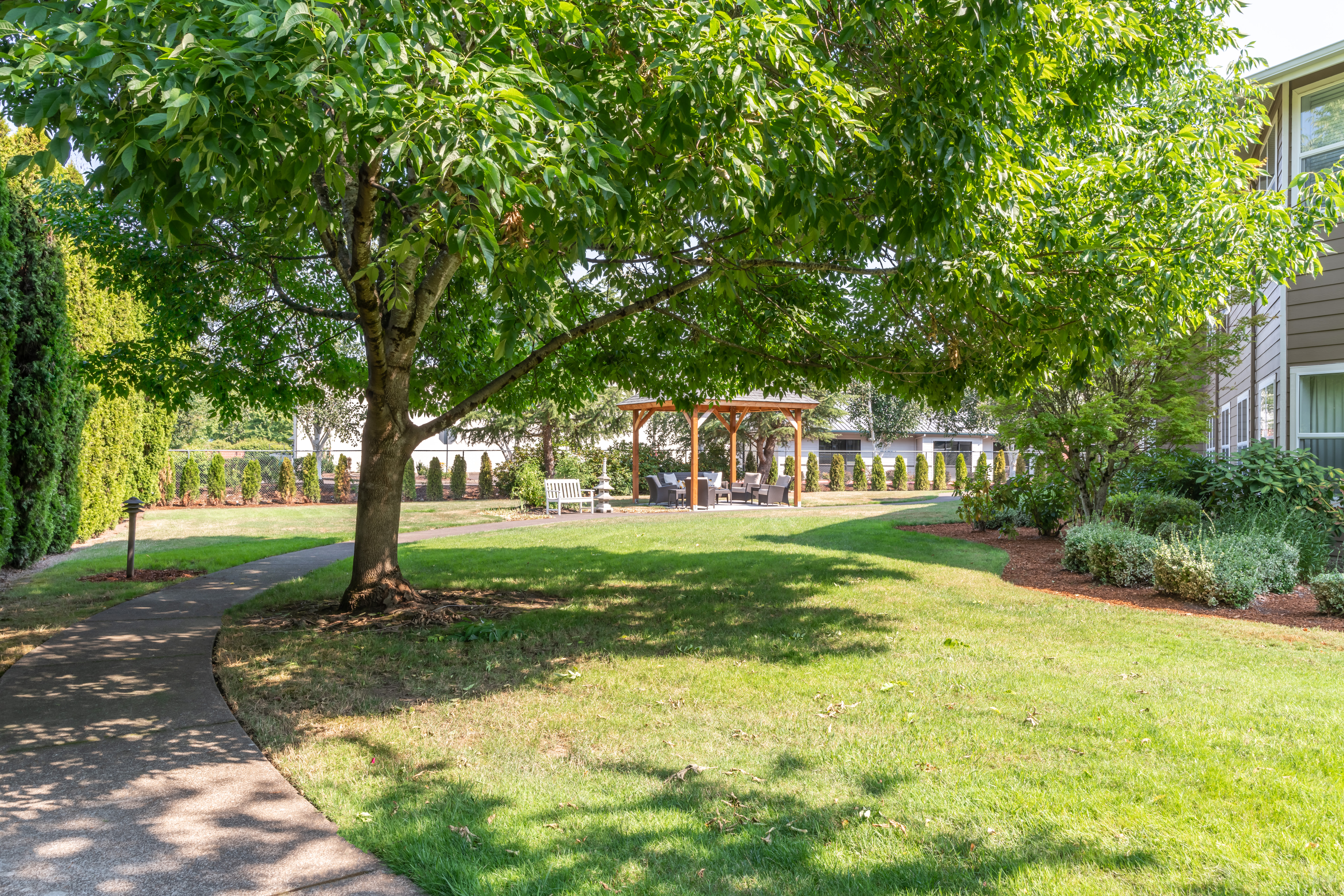 Outside area with beautiful landscaping at Heron Pointe Senior Living in Monmouth, Oregon