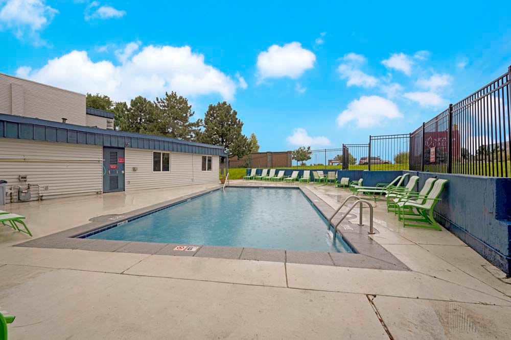 Apartments with a swimming pool at Arvada Green Apartment Homes in Arvada, Colorado