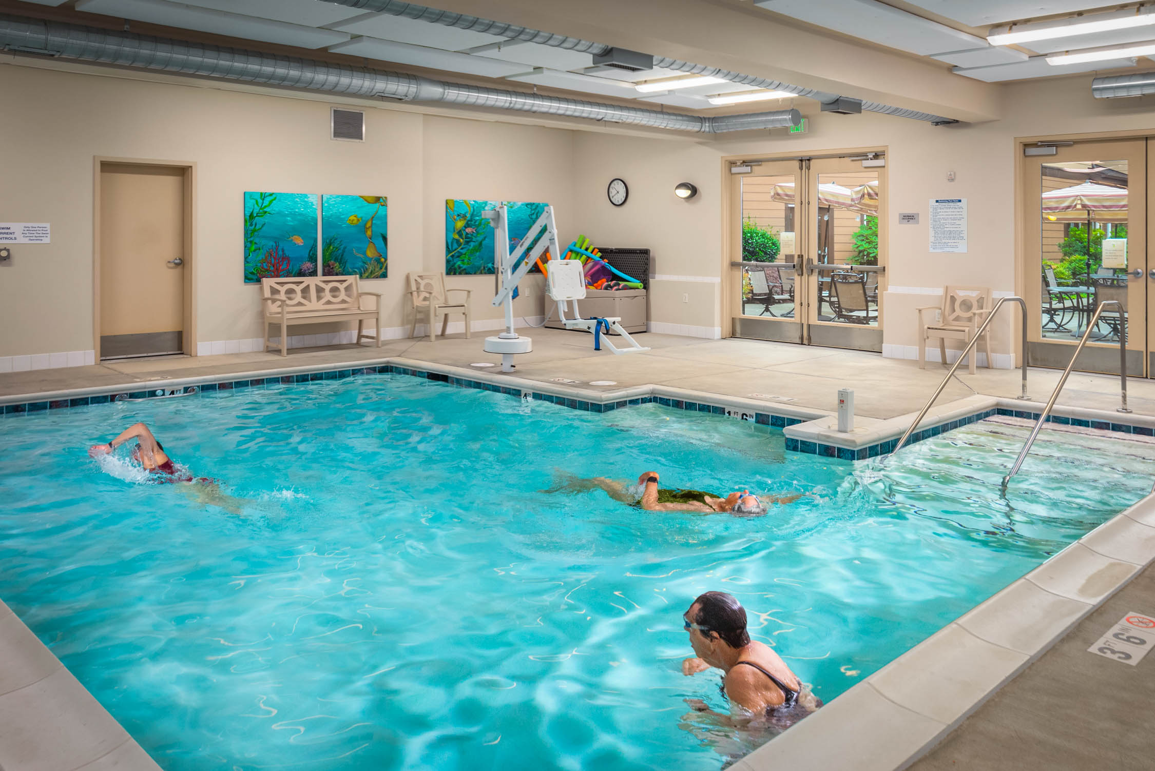 Seniors swimming in indoor pool Quail Park of Lynnwood in Lynnwood, Washington