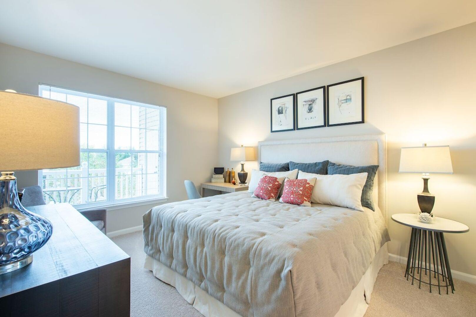 A cozy bedroom designed with soft lighting at The Elms at Germantown in Germantown, Maryland