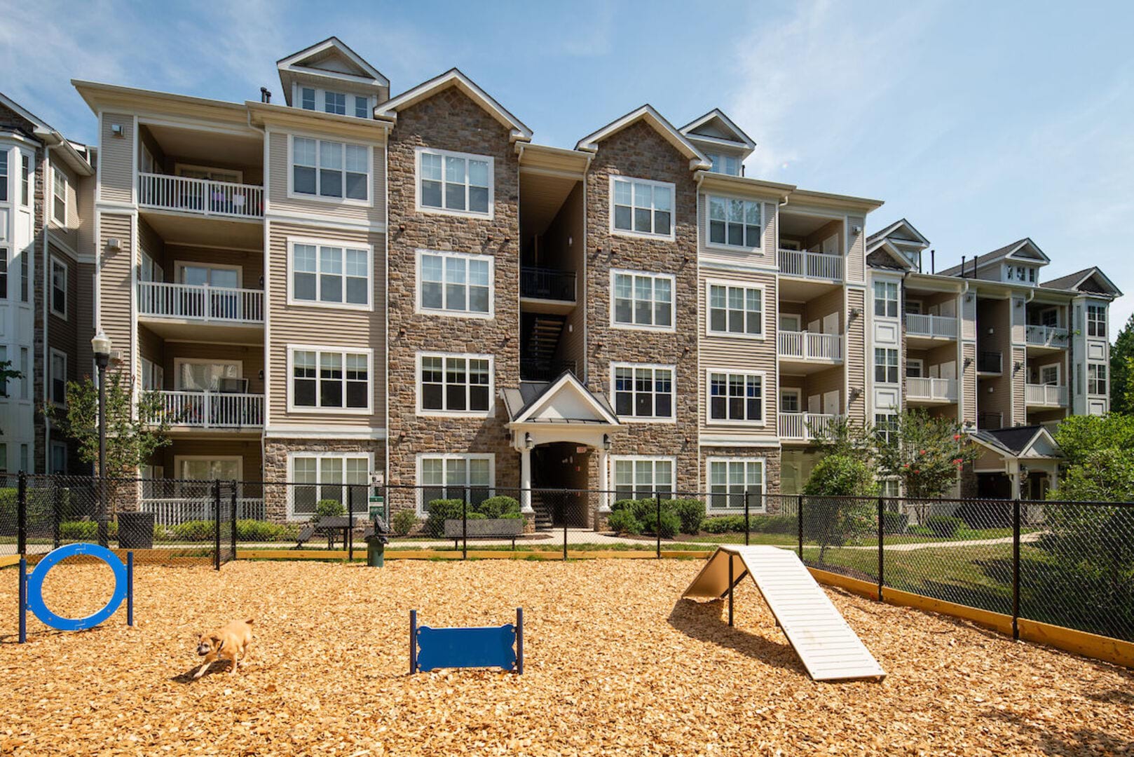 On-site dog park in-front of the apartments at The Elms at Stoney Run Village in Hanover, Maryland