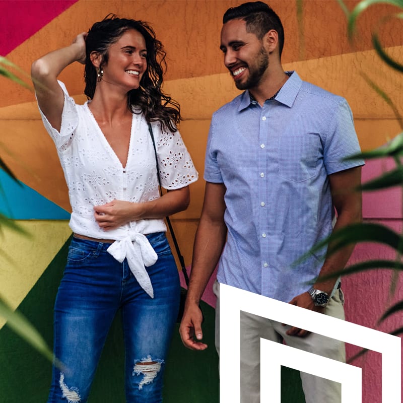 Residents standing in front of a mural at Motif in Fort Lauderdale, Florida