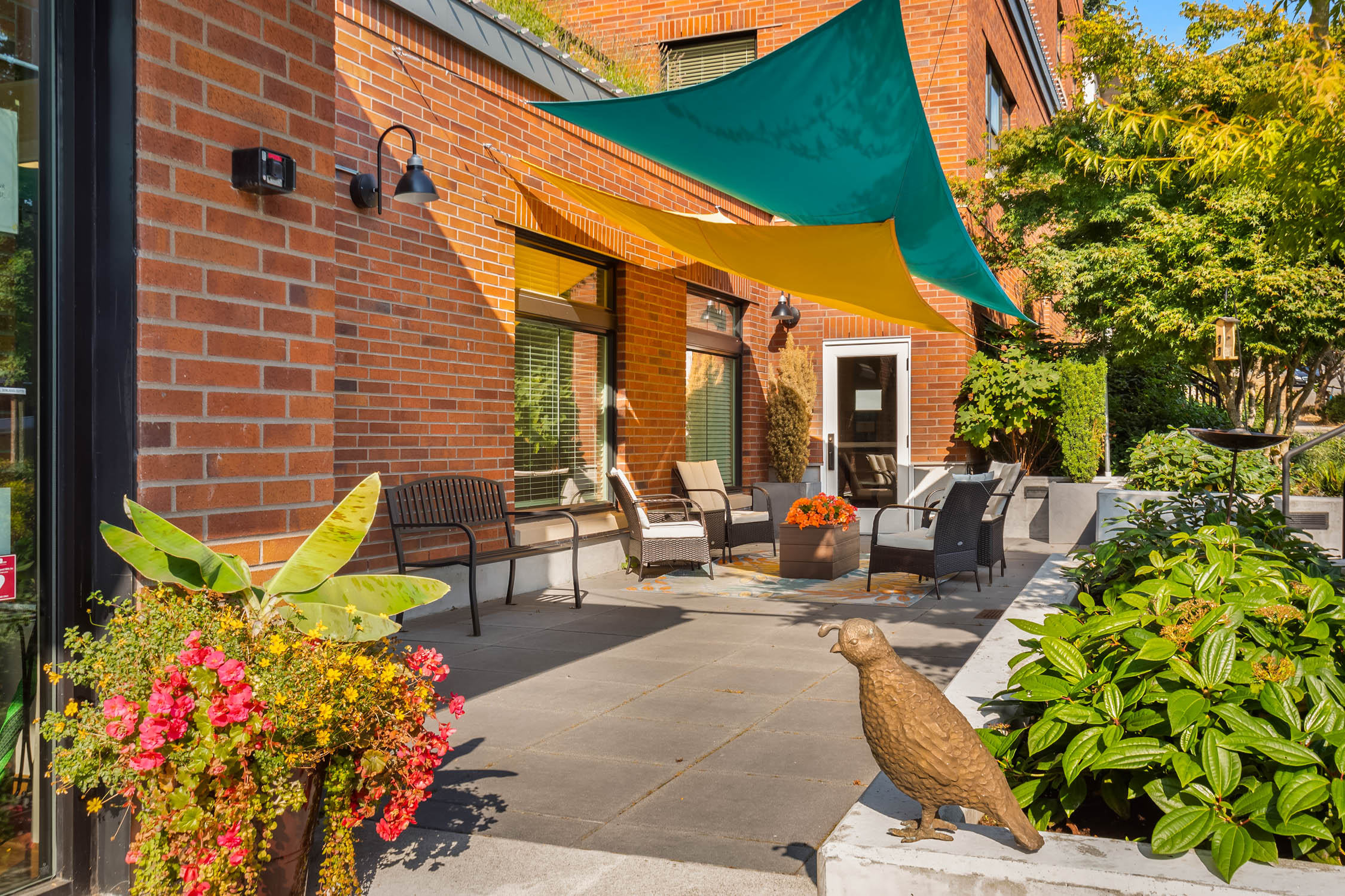 Enjoy a Common Area with Garden Beside at Quail Park Memory Care Residences of West Seattle Independent Living Facility