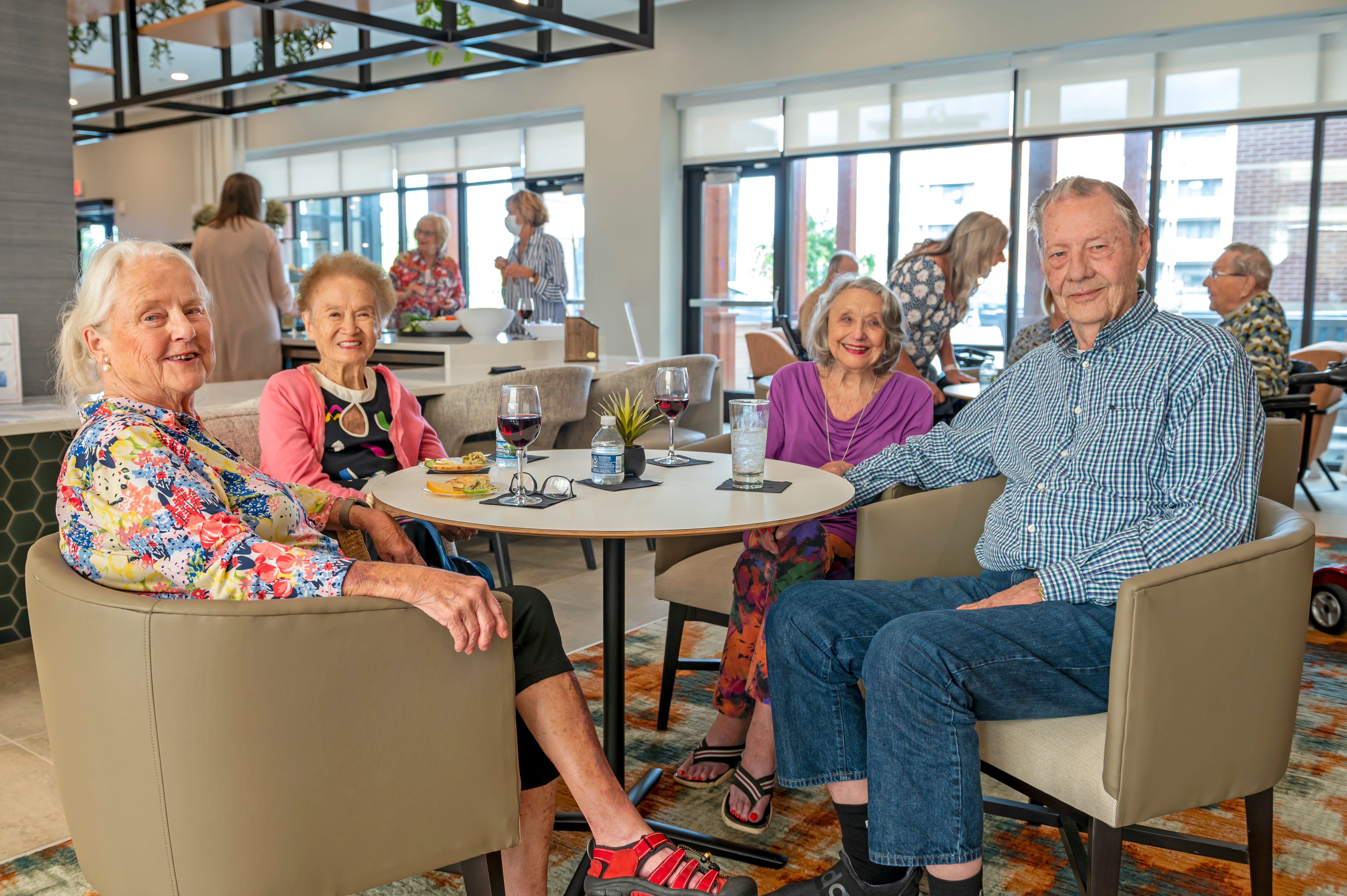 Residents laughing together during breakfast at Anthology of Blue Ash in Blue Ash, Ohio