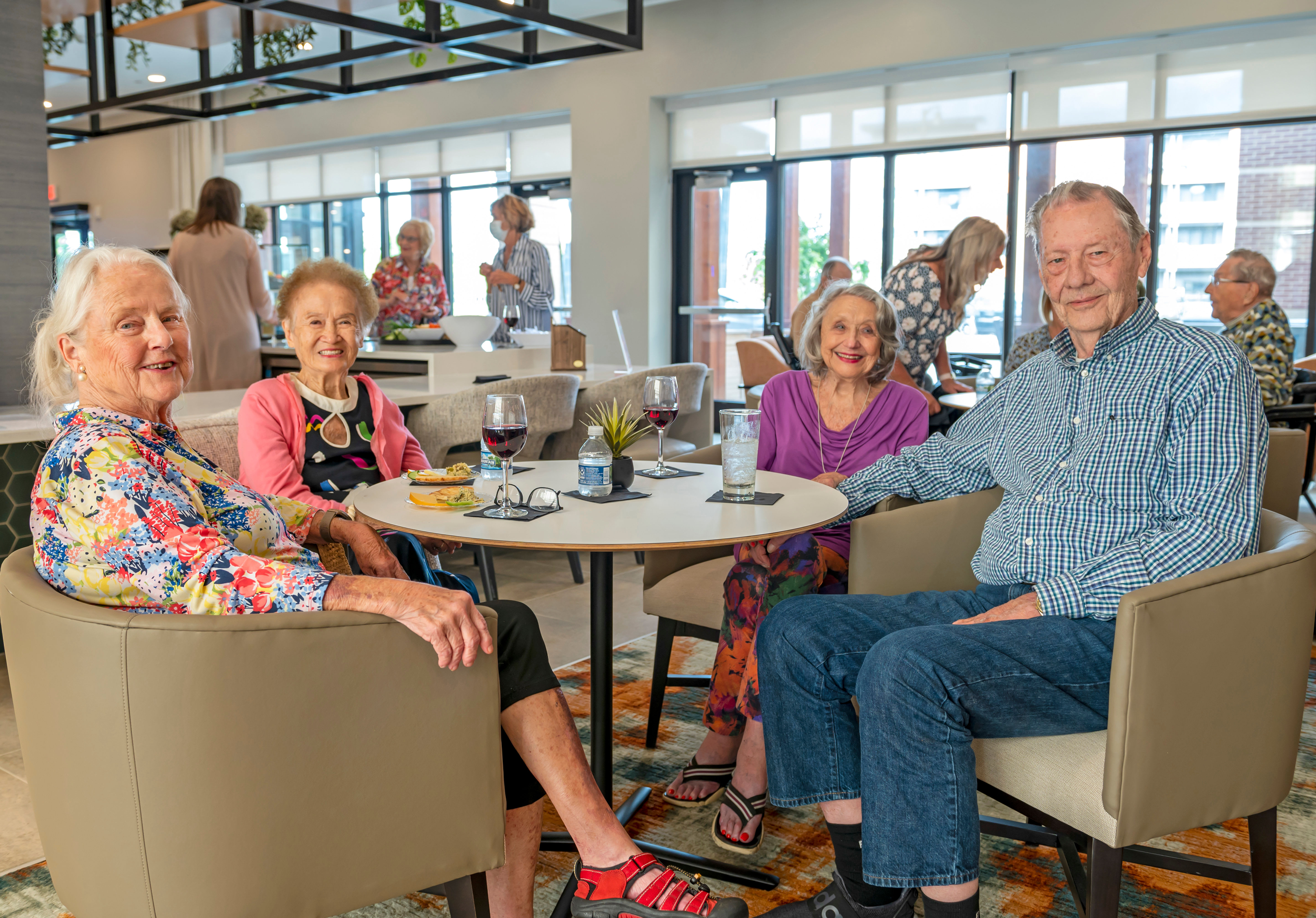 Residents laughing together during breakfast at Anthology of Charlottesville in Charlottesville, Virginia