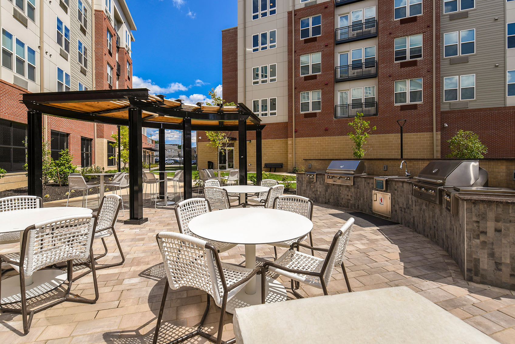 Patio seating with a grill in the courtyard atSilverLake in Belleville, New Jersey