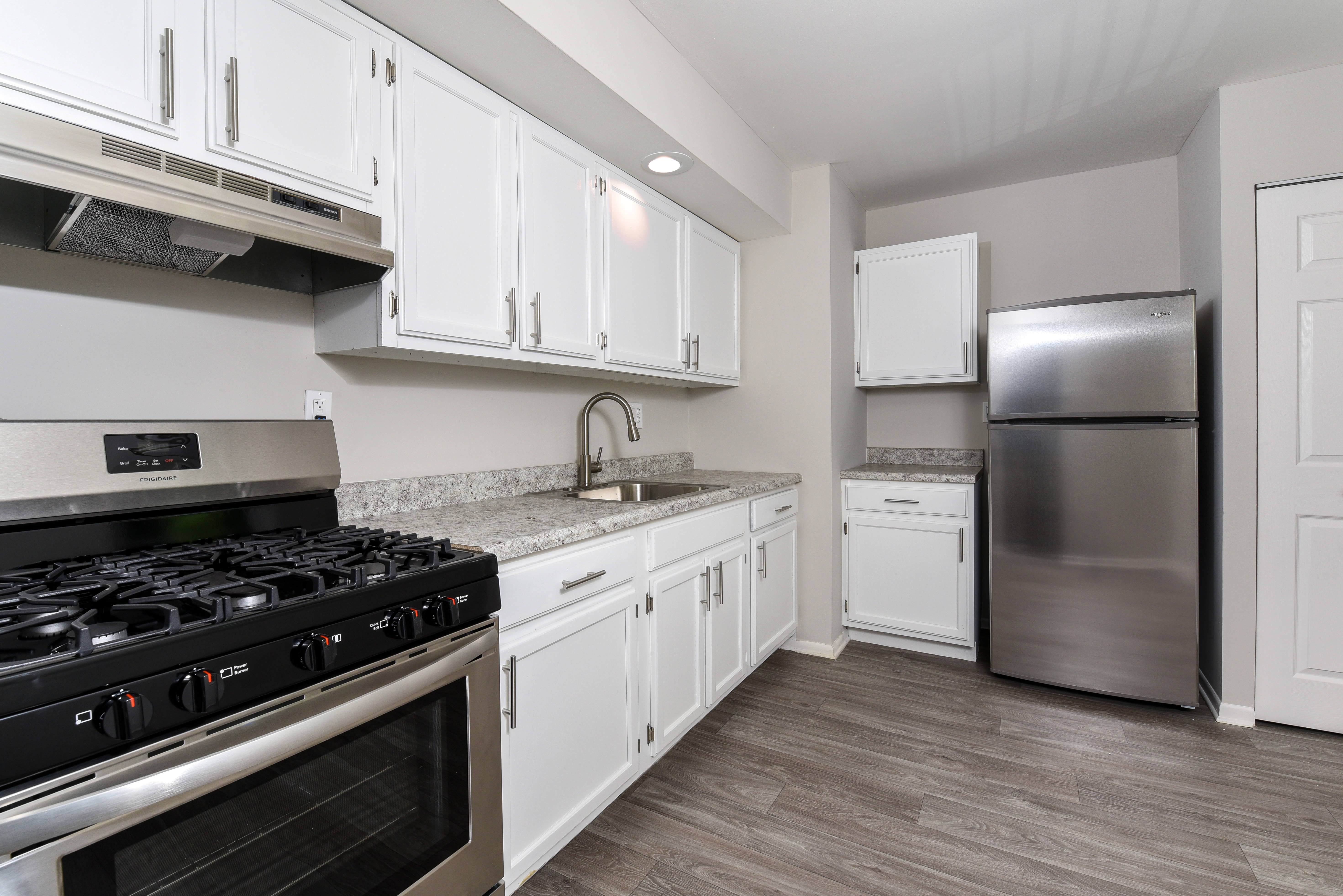 Model kitchen with white cabinets at The Nolan, Morrisville, Pennsylvania