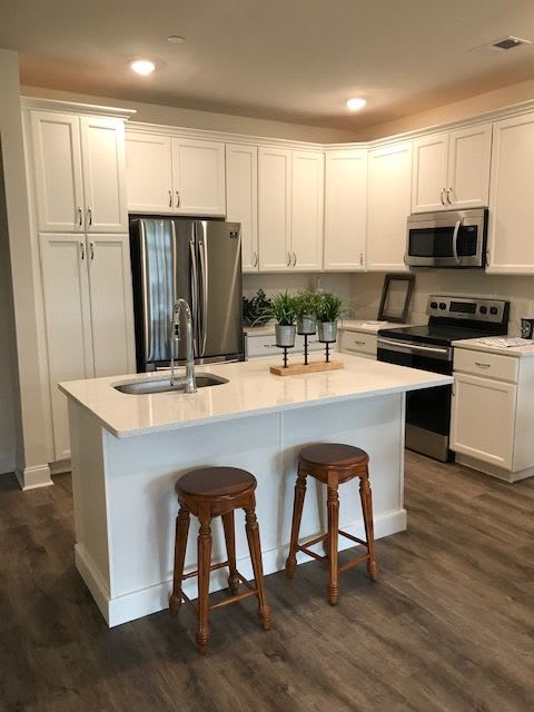 Model kitchen with white cabinets at The Residences at St. Joseph Court, Levittown, Pennsylvania