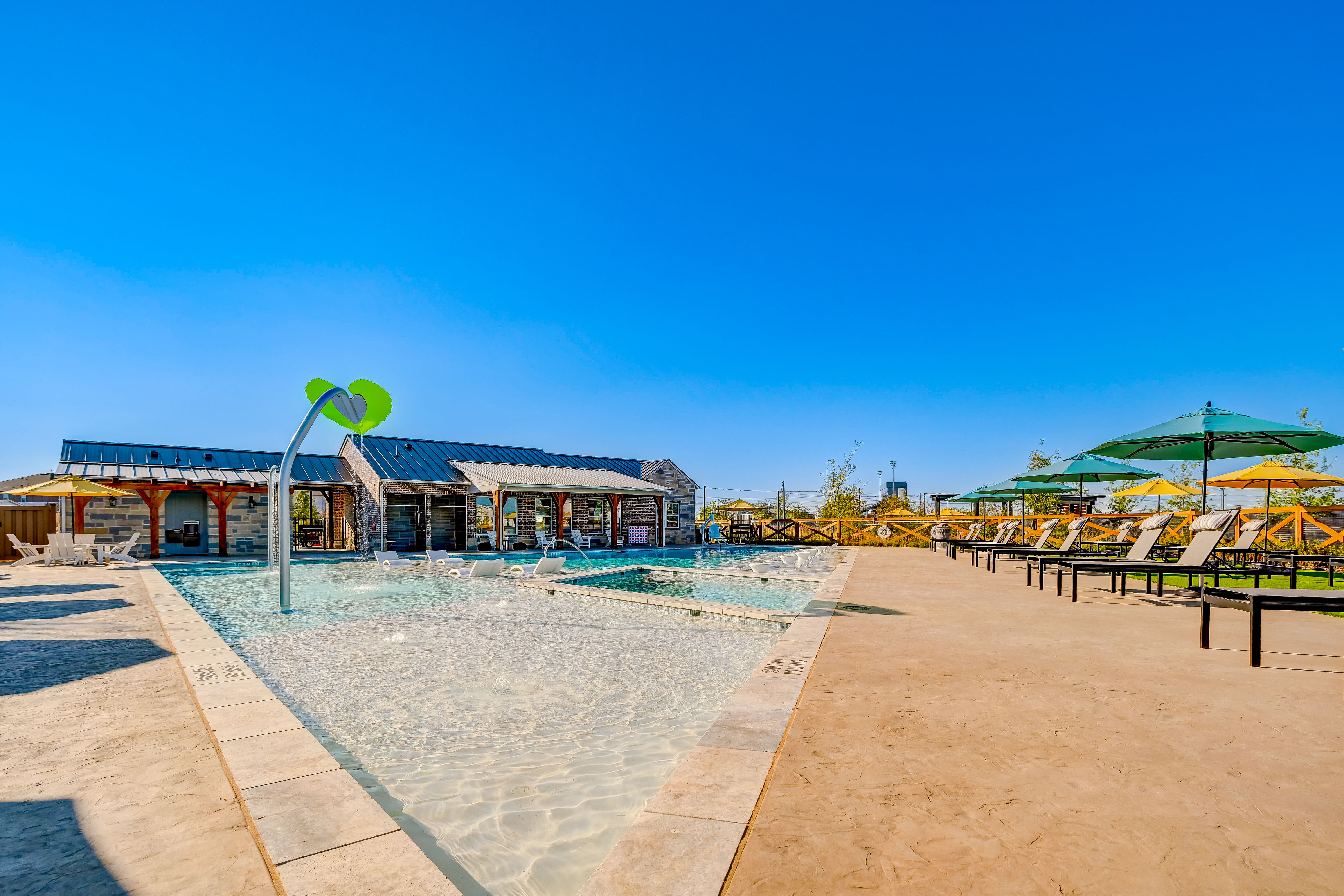 Swimming Pool and splash pad at BB Living Light Farms in Celina, Texas