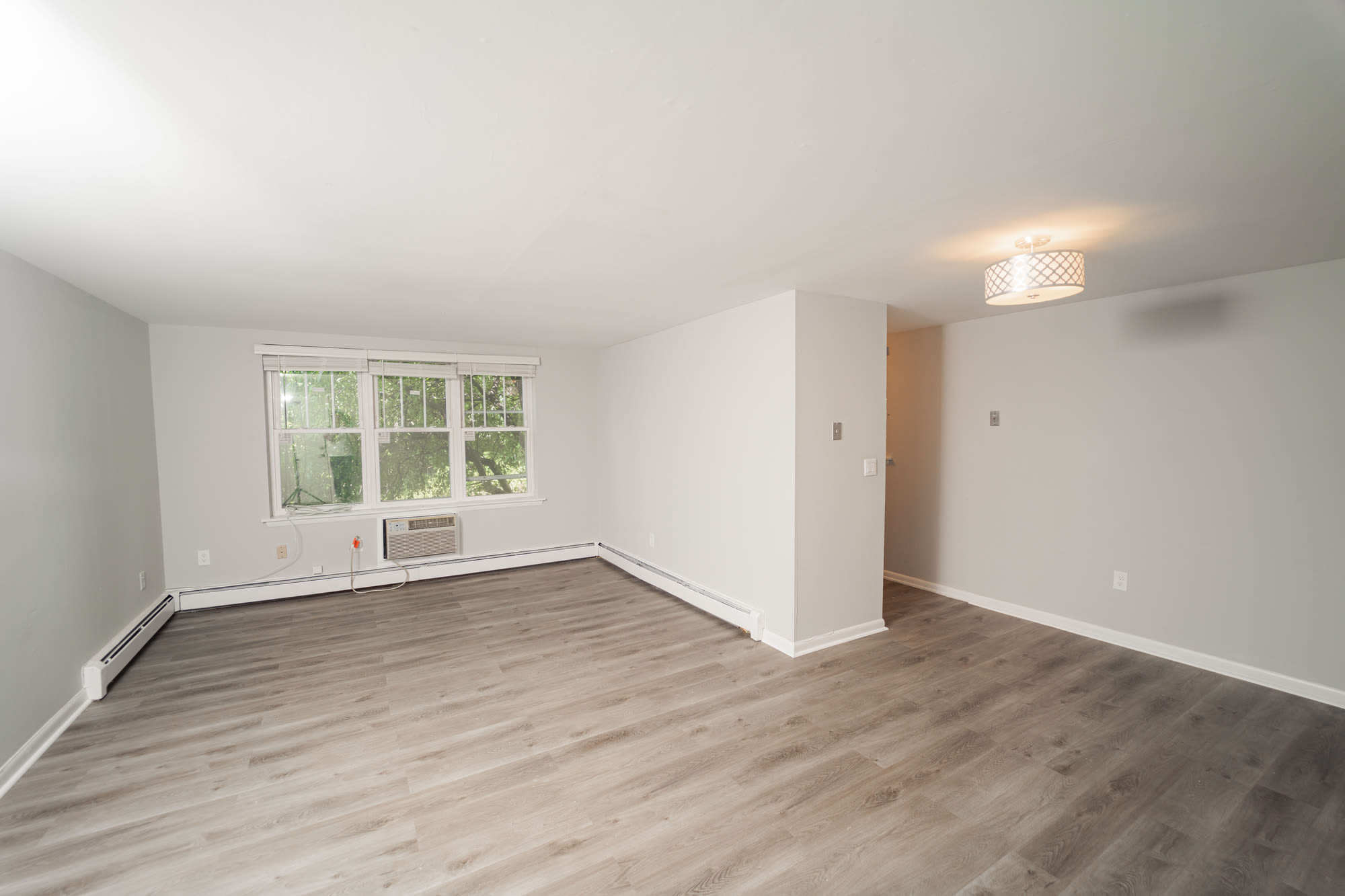 Light and bright living area at Enclave & Parc West in West Hartford, Connecticut