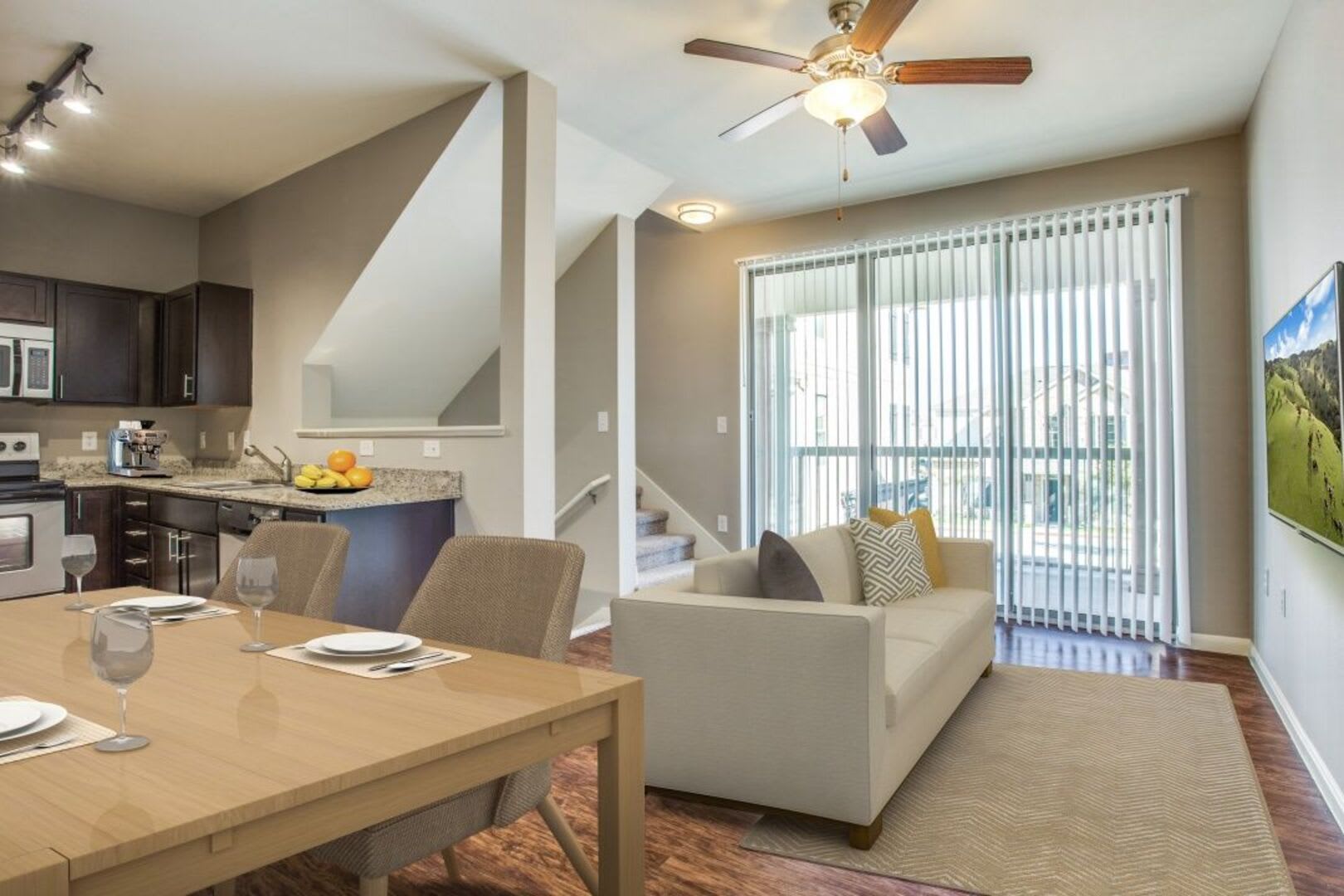 Retro-modern furniture and classic decor in a model home's living area at Parkside Towns in Richardson, Texas