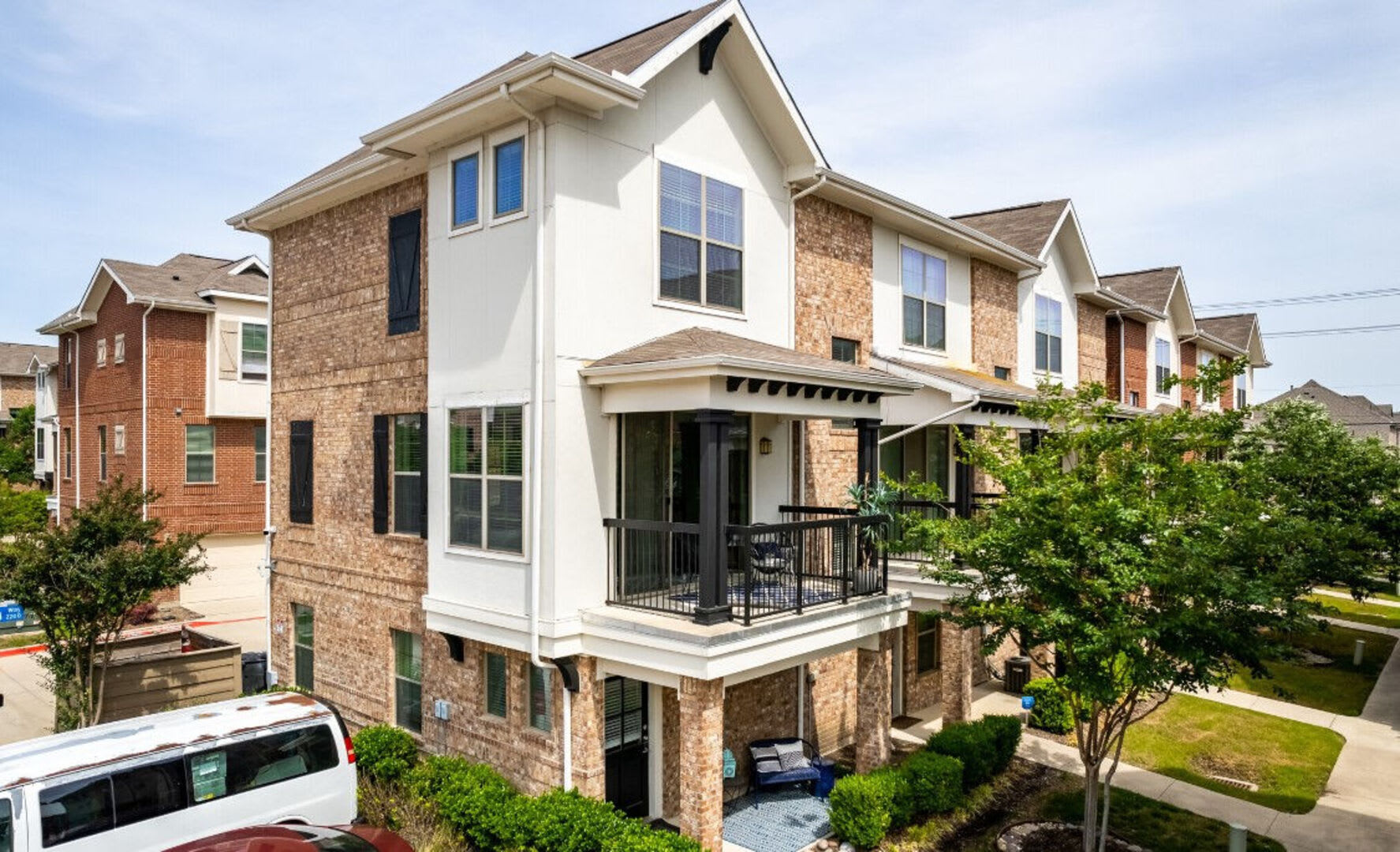 Landscaped grounds and building exterior at Parkside Towns in Richardson, Texas