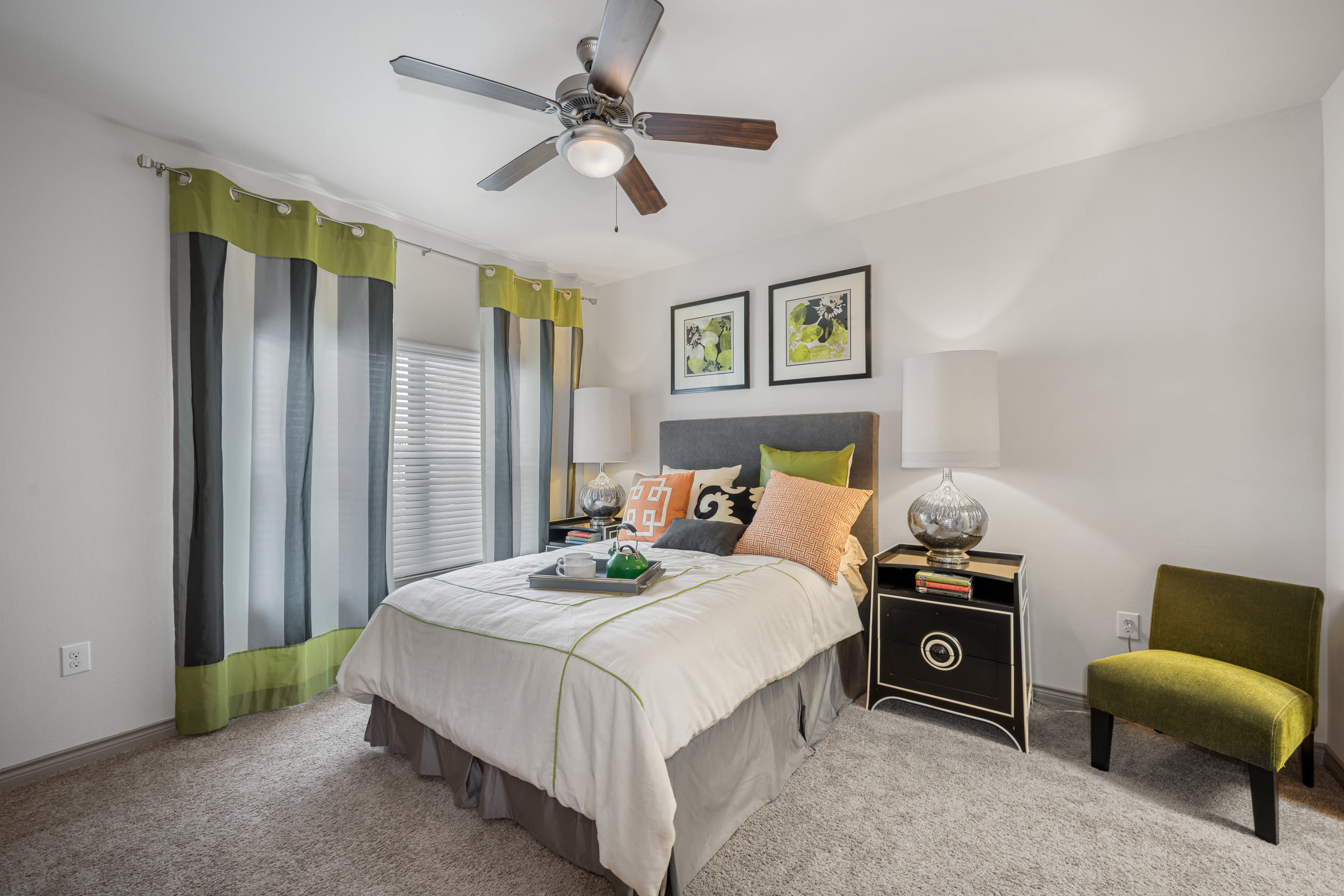Model bedroom with large window at The BLVD in San Angelo, Texas