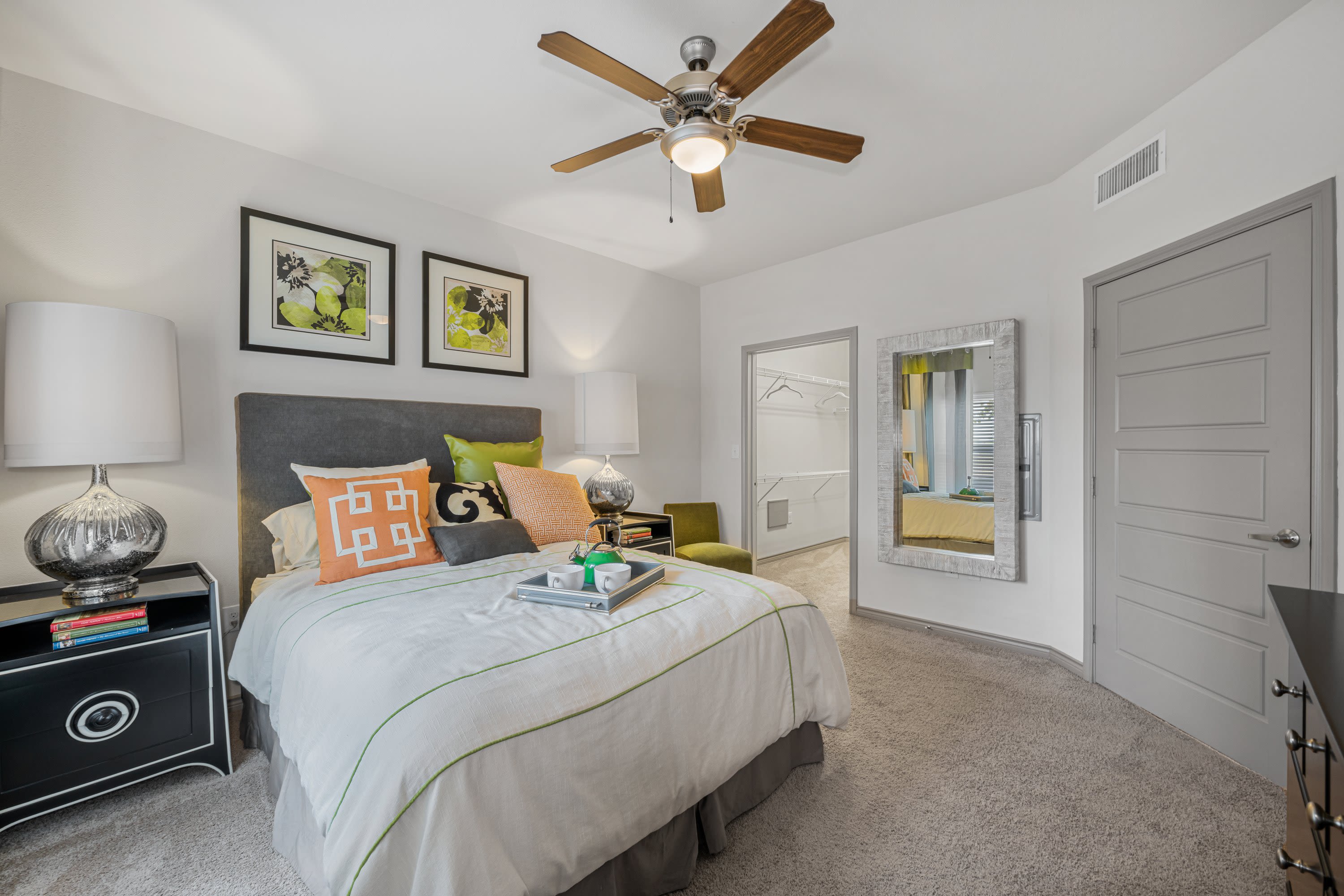 Model bedroom with cozy decor at The BLVD in San Angelo, Texas